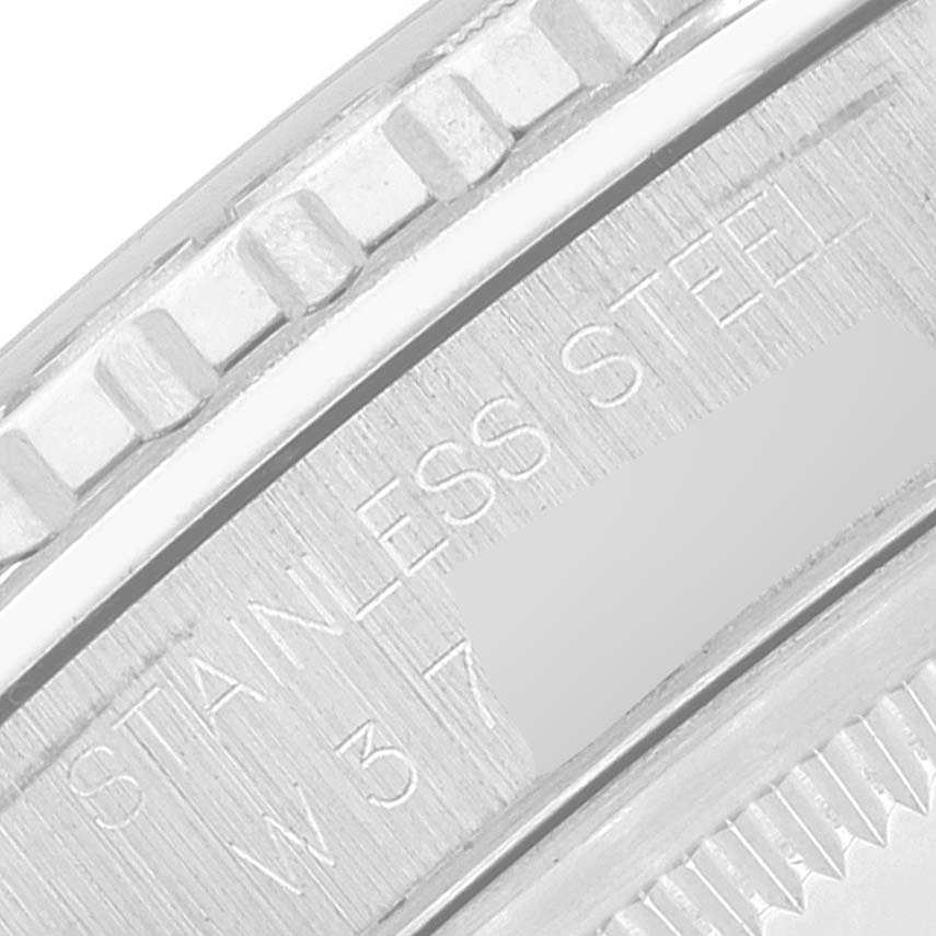 This close-up angle shows the bezel and part of the case back of the Rolex Turn-o-Graph 16264 Men's Stainless Steel White Dial 16264 Men's Stainless Steel White Dial watch with "Stainless Steel" engraving.