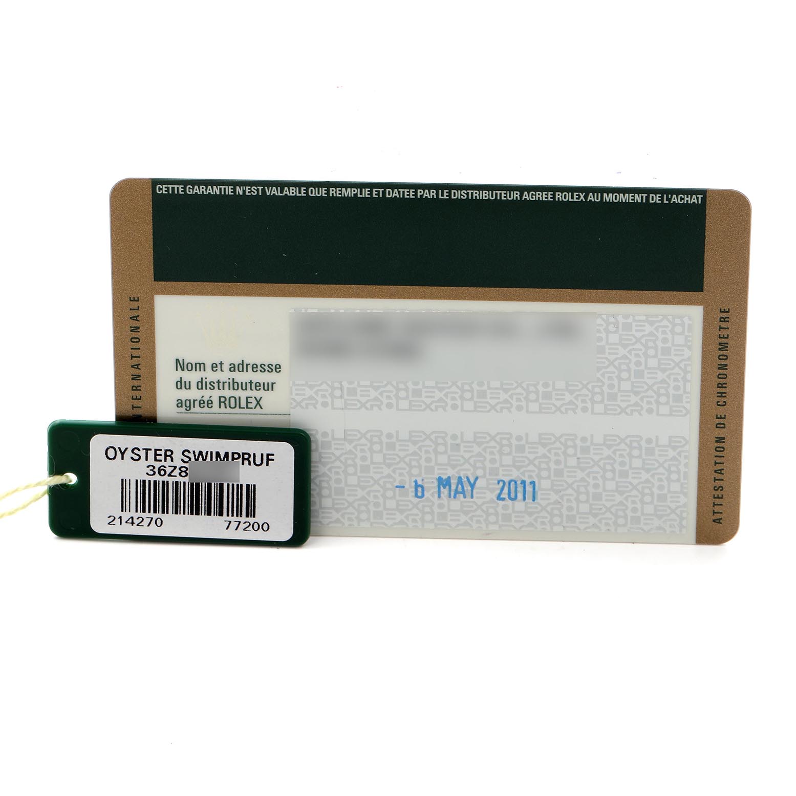 The image shows a Rolex warranty card and an Oyster Swimpruf tag for the Explorer model.