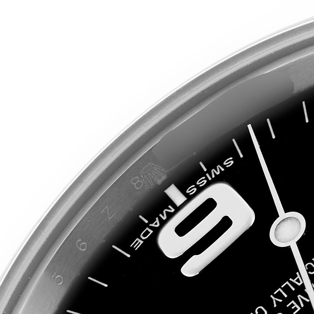 The image shows a close-up of the dial edge of a Rolex Explorer 214270 Men
s Stainless Steel Black Dial 214270 Men
s Stainless Steel Black Dial, highlighting the numeral "9" and part of the minute markers.