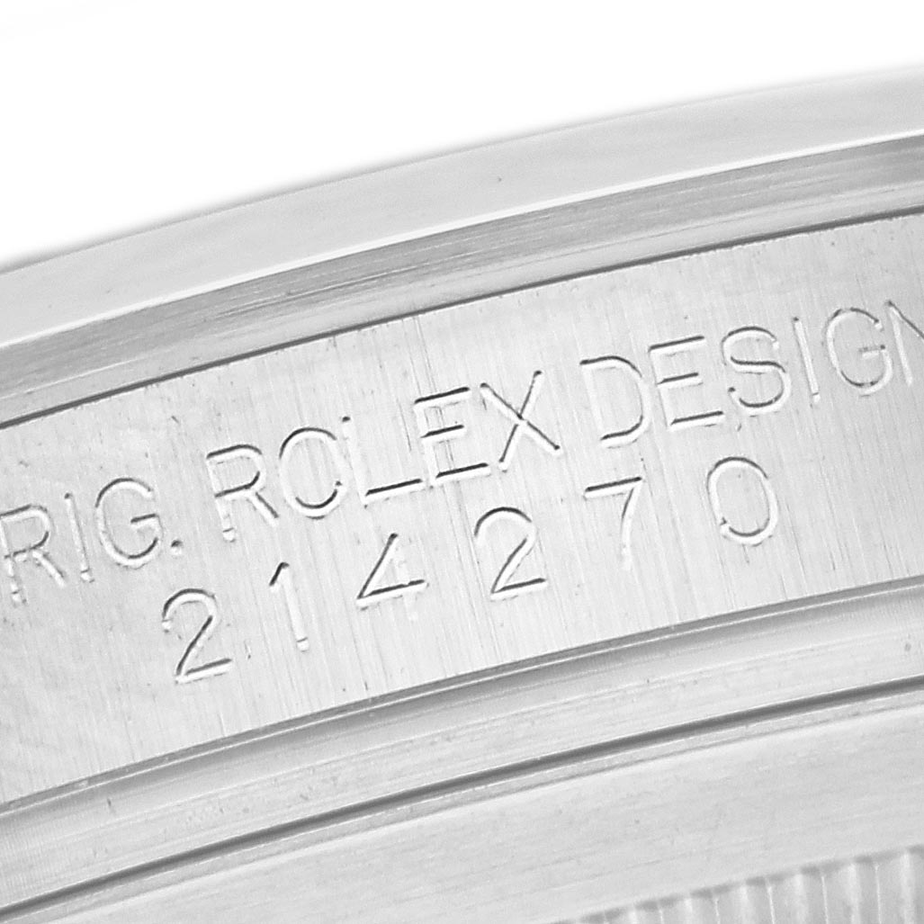 The image shows a close-up of the engraved bezel edge on a Rolex Explorer 214270 Men
s Stainless Steel Black Dial 214270 Men
s Stainless Steel Black Dial watch.