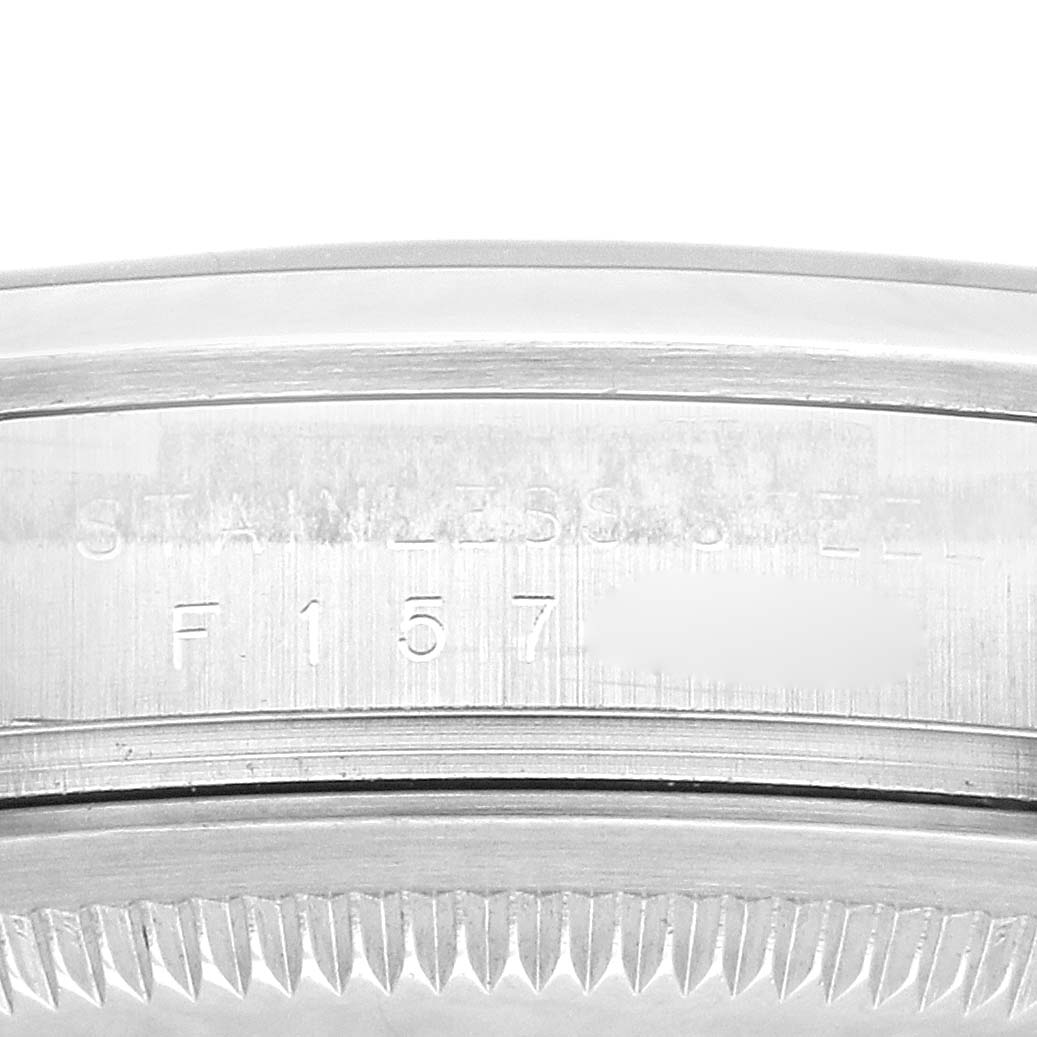 The image shows a close-up of the case side edge and bezel serrations of the Rolex Explorer 114270 Men
s Stainless Steel Black Dial 114270 Men
s Stainless Steel Black Dial, highlighting the "Stainless Steel" engraving.