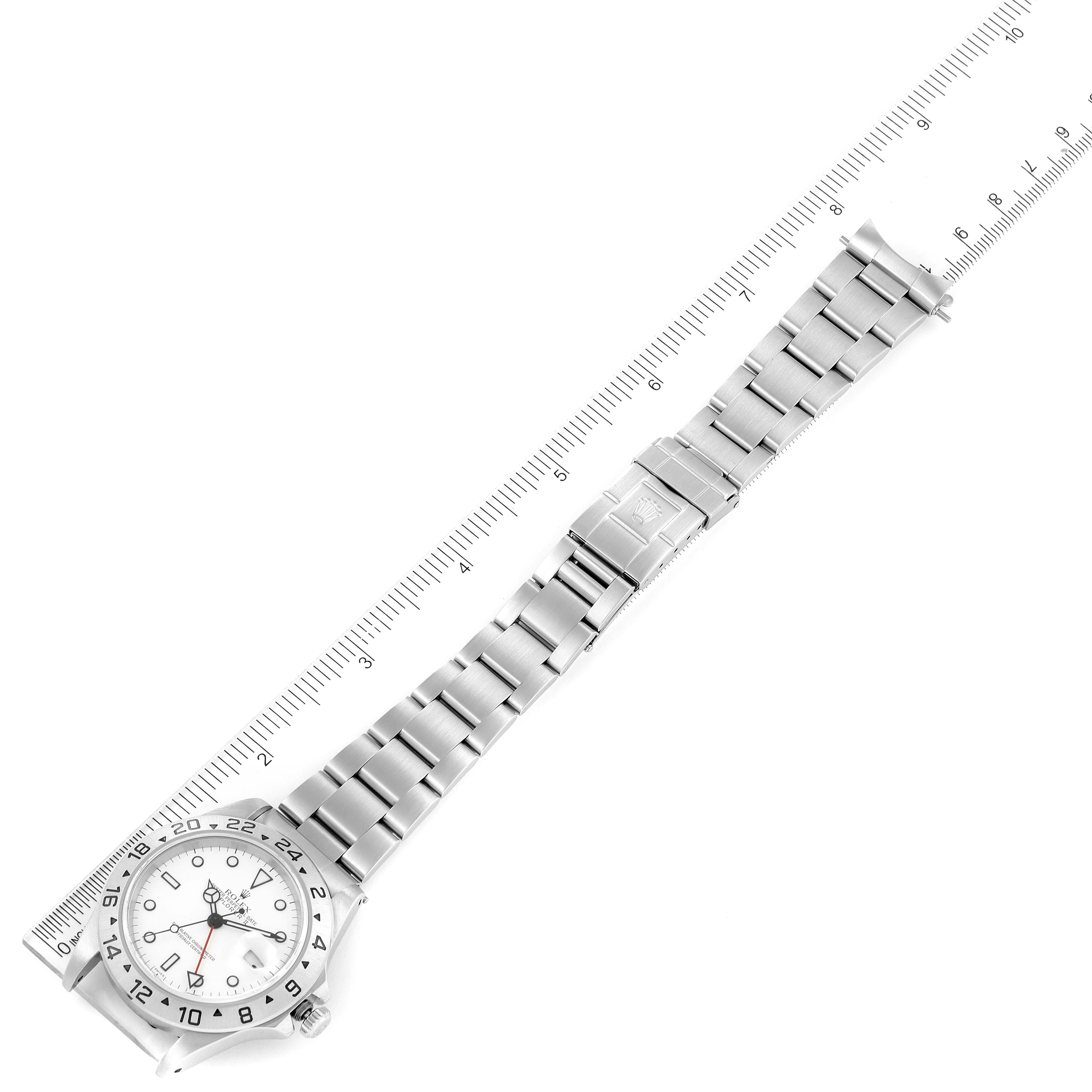 The image shows a top-down view of a Rolex Explorer 16570 Men's Stainless Steel White Dial 16570 Men's Stainless Steel White Dial watch, highlighting the full length of the bracelet alongside a ruler.
