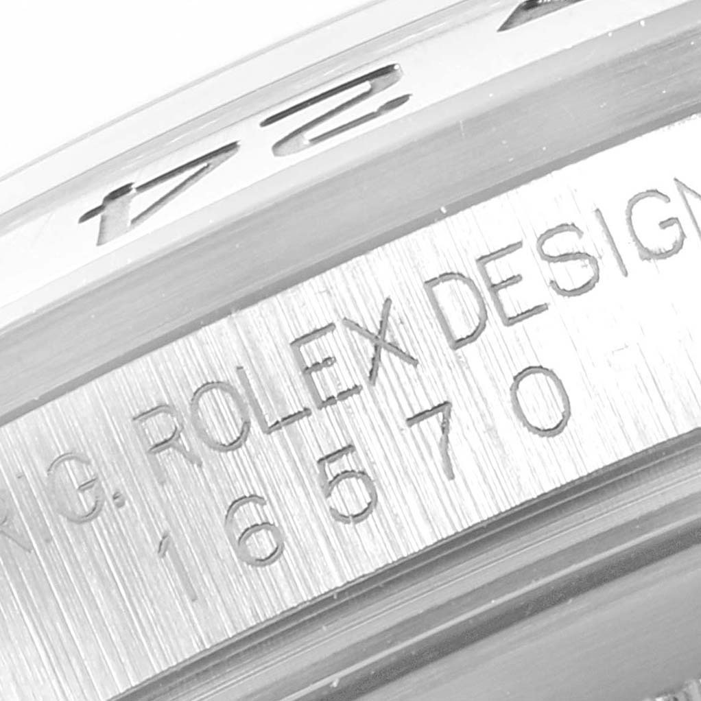 The image shows an angled close-up of the bezel and engraved model number on a Rolex Explorer 16570 Men's Stainless Steel White Dial 16570 Men's Stainless Steel White Dial watch.