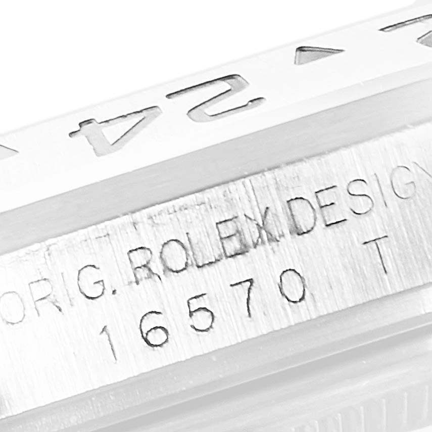 This image shows a close-up view of the engraved model number and bezel of a Rolex Explorer 16570 Men's Stainless Steel Black Dial 16570 Men's Stainless Steel Black Dial watch.