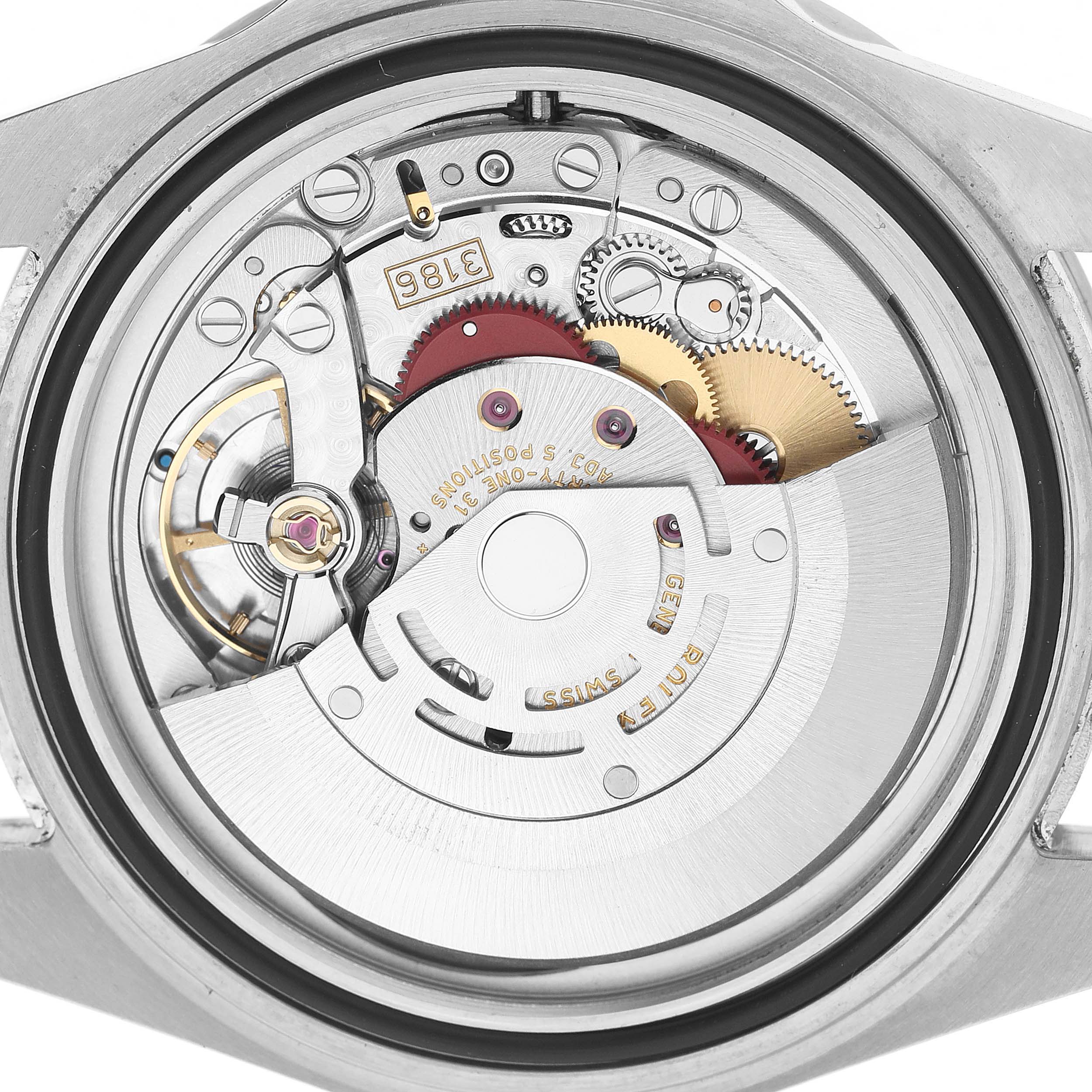 The image shows the back of a Rolex Explorer 16570 Men's Stainless Steel White Dial watch, revealing its internal mechanical movement and gears.