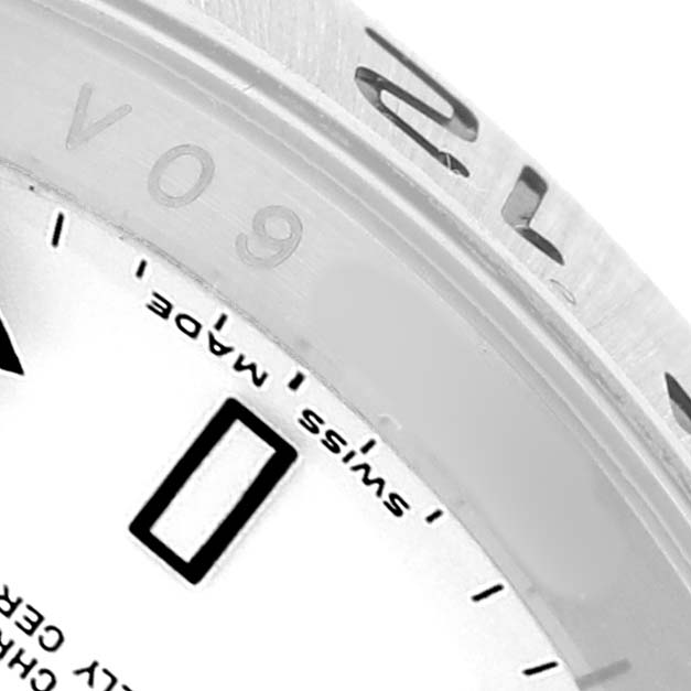 The image shows a close-up of the Rolex Explorer 16570 Men's Stainless Steel White Dial's outer bezel and part of the dial, highlighting the "SWISS MADE" text.
