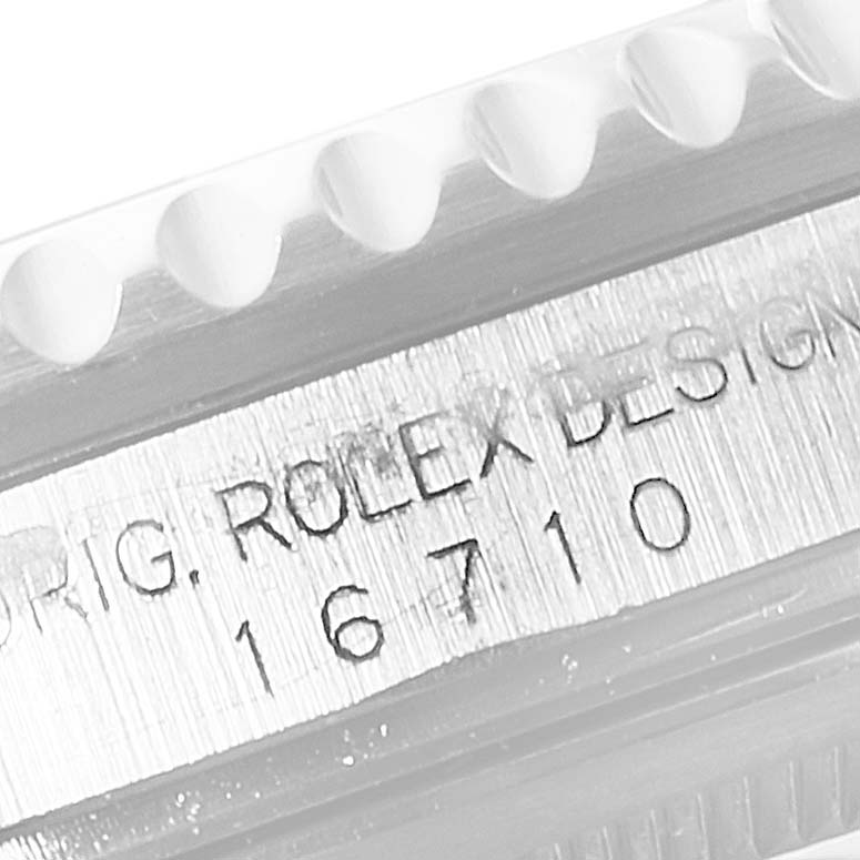 This image shows a close-up of the engraving on the side of a Rolex GMT-Master 16710 Men's Stainless Steel Black Dial 16710 Men's Stainless Steel Black Dial, model number 16710.