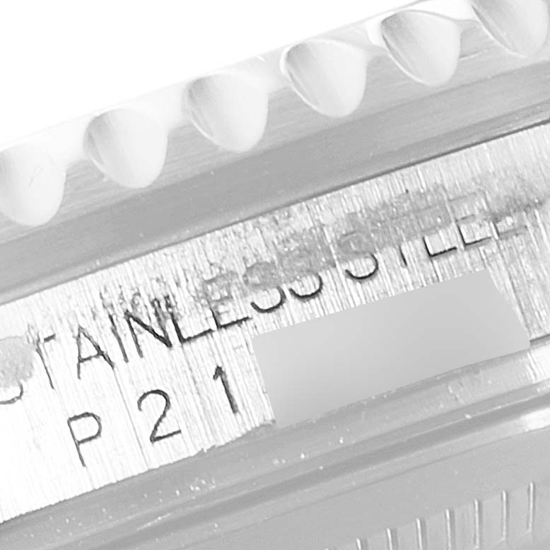 This image shows a close-up of the side engraving indicating "STAINLESS STEEL" on a Rolex GMT-Master 16710 Men's Stainless Steel Black Dial 16710 Men's Stainless Steel Black Dial watch.