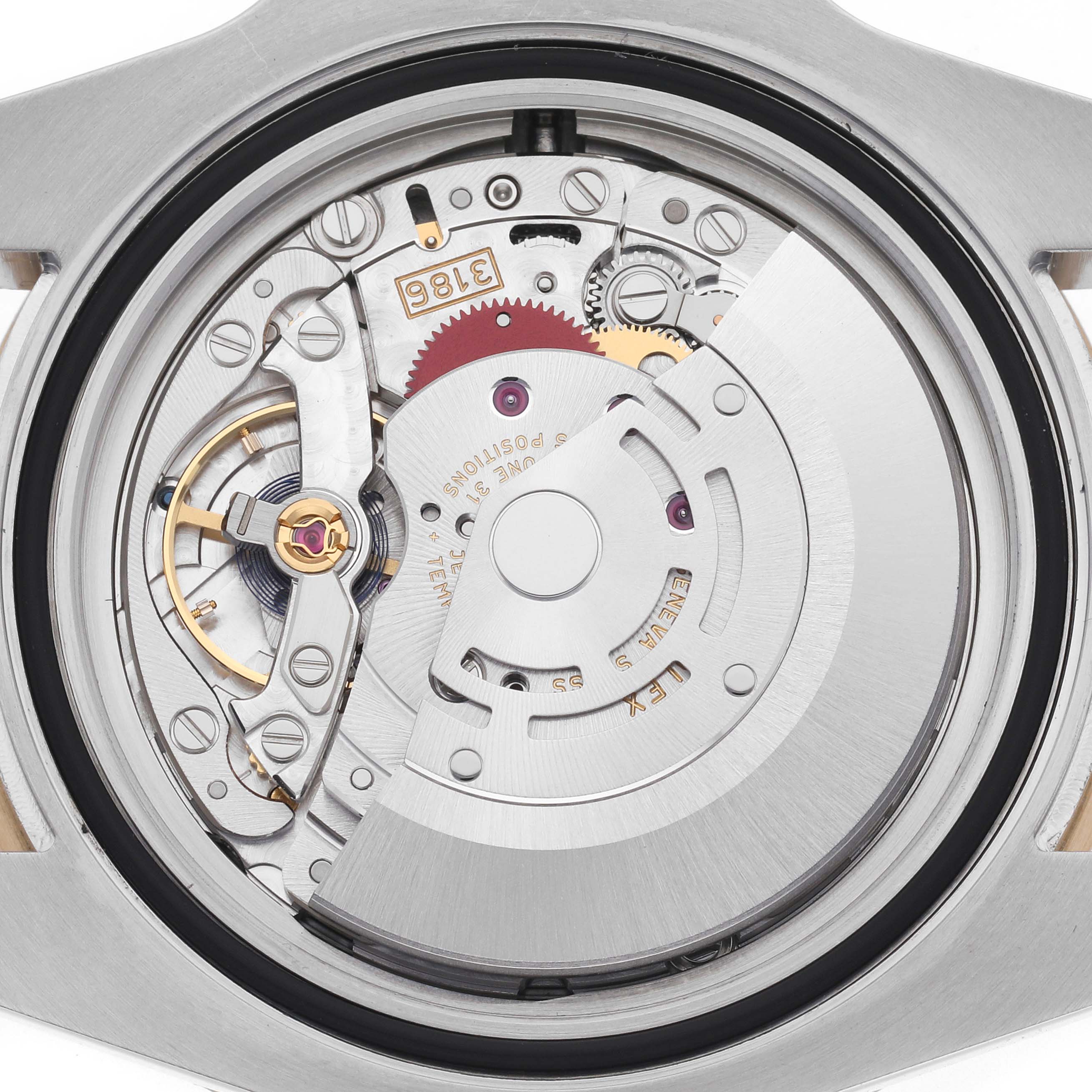 The image shows the back view of a Rolex GMT-Master 116713LN Men
s Steel and Gold (two tone) Black Dial 116713LN Men
s Steel and Gold (two tone) Black Dial watch, highlighting its exposed mechanical movement and rotor.