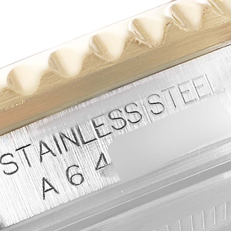 The image shows a close-up of the stainless steel casing and serial number area of a Rolex GMT-Master 16713 Men's Steel and Gold (two tone) Black Dial 16713 Men's Steel and Gold (two tone) Black Dial watch.