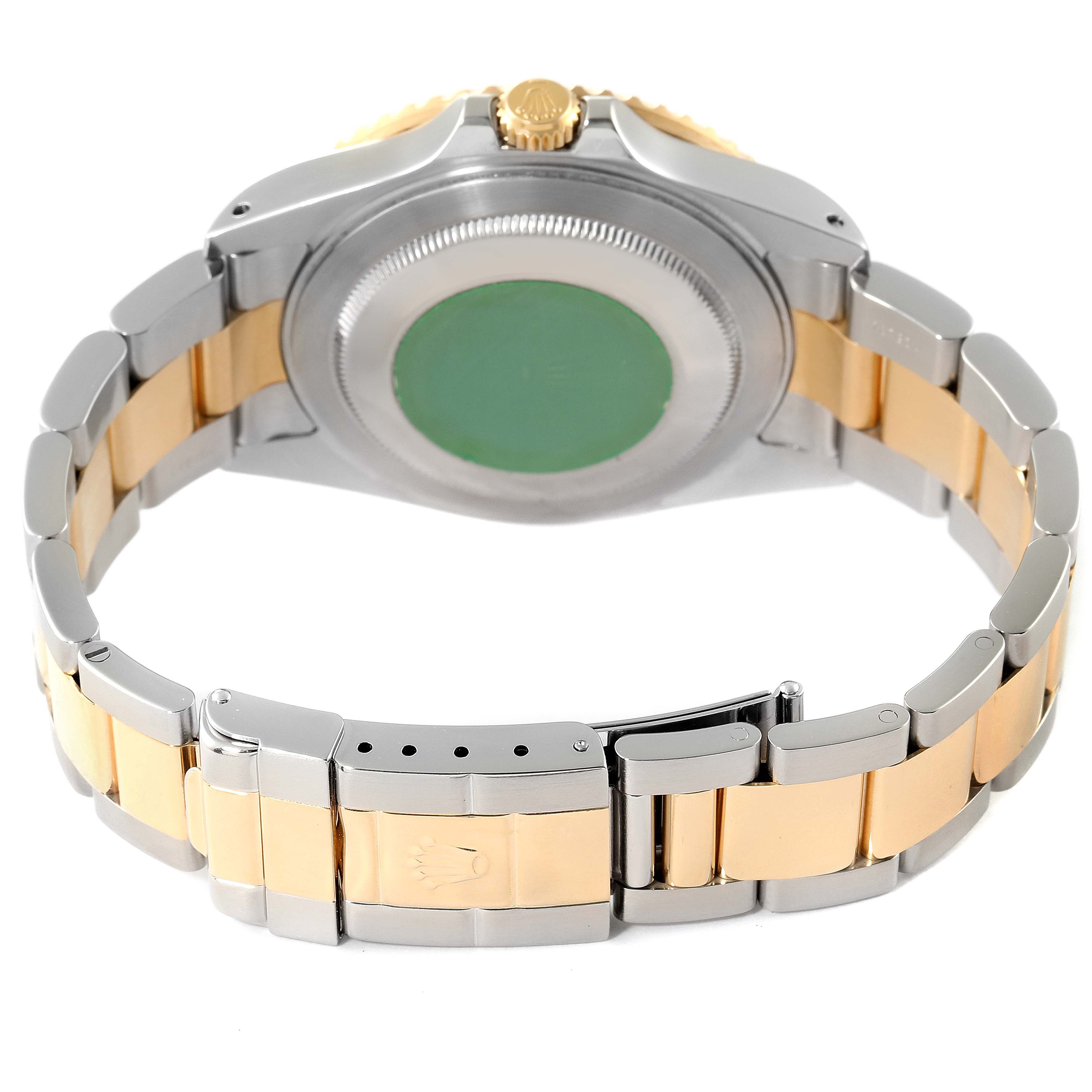 The image shows the back case and two-tone bracelet of a Rolex GMT-Master 16713 Men's Steel and Gold (two tone) Black Dial 16713 Men's Steel and Gold (two tone) Black Dial watch, including the clasp and crown.