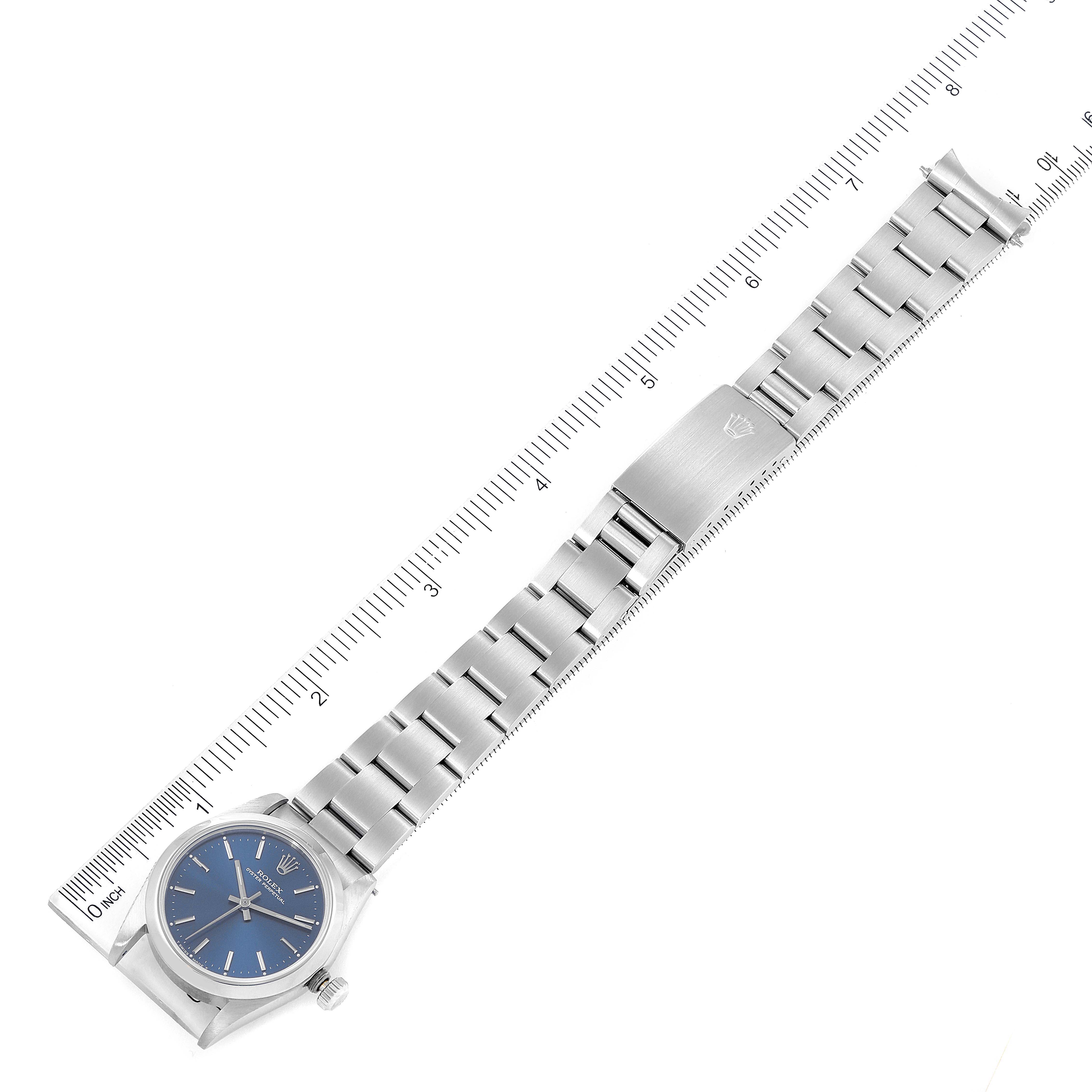 This image shows a Rolex Mid-Size 67480 Women's Stainless Steel Blue Dial 67480 Women's Stainless Steel Blue Dial model watch laid flat, displaying the full bracelet and watch face from an overhead angle.
