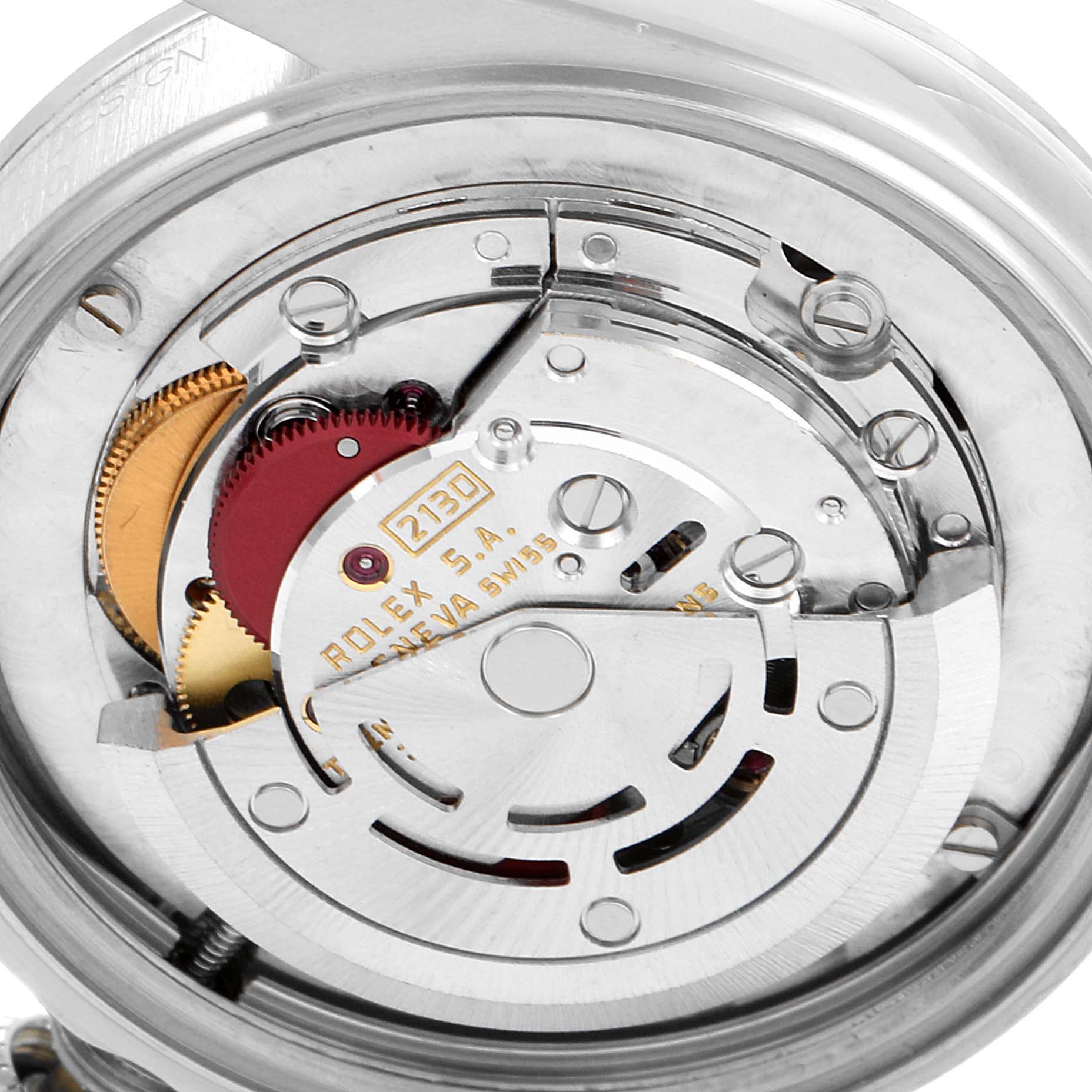 The image shows the internal mechanism and movement of a Mid-Size Rolex watch from a rear angle.