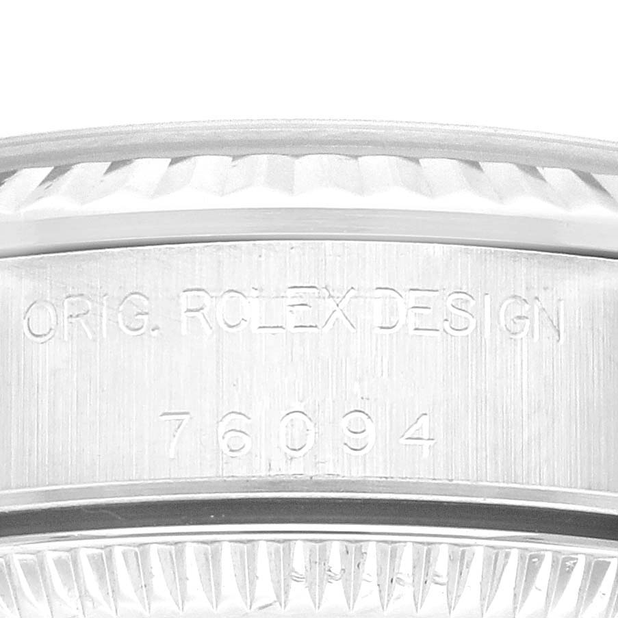 This image shows a close-up of the engraving on the side of an Oyster Perpetual Rolex watch case.