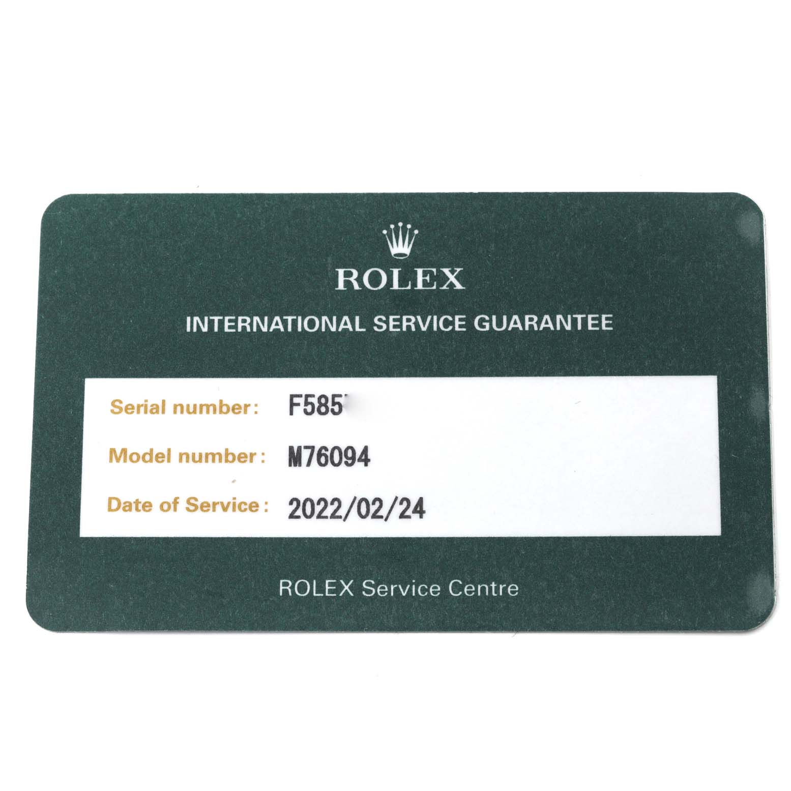 The image shows a Rolex International Service Guarantee card for an Oyster Perpetual model, indicating the serial number, model number, and service date.