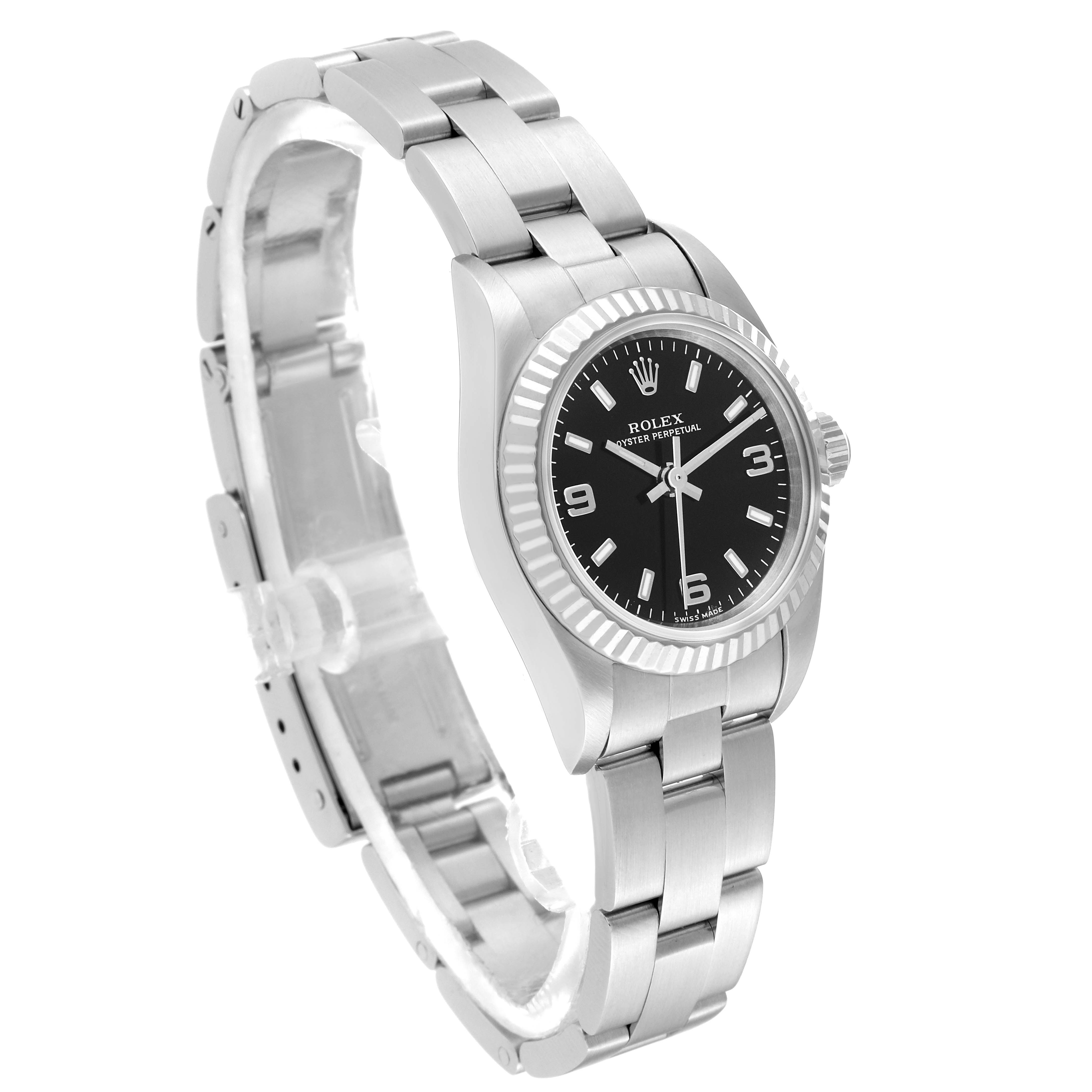 The image shows a Rolex Oyster Perpetual M76094 Women's Stainless Steel Black Dial M76094 Women's Stainless Steel Black Dial watch at an angle displaying its silver bracelet, black dial, and fluted bezel.