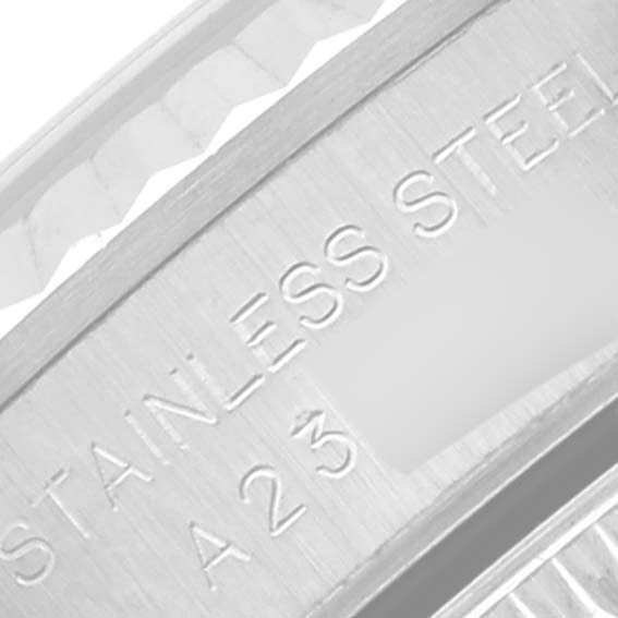 This close-up angle shows the side engraving on the Oyster Perpetual Rolex watch, displaying "STAINLESS STEEL" and "A 23".