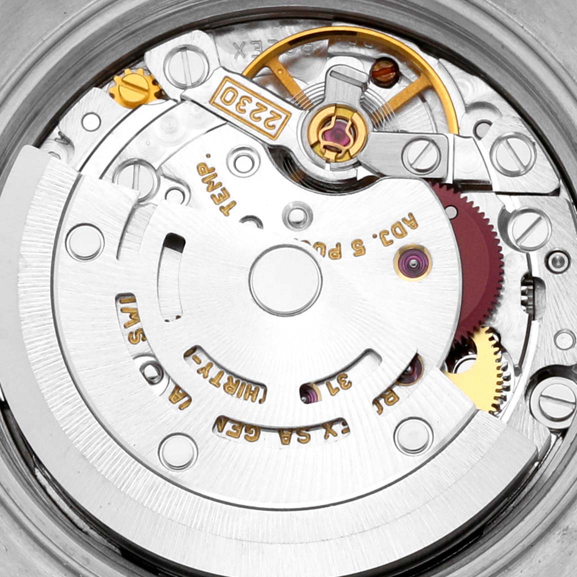 The image shows a close-up view of the internal mechanism of a Rolex Oyster Perpetual 76094 Women's Stainless Steel Pink Dial 76094 Women's Stainless Steel Pink Dial watch, highlighting gears and the rotor.