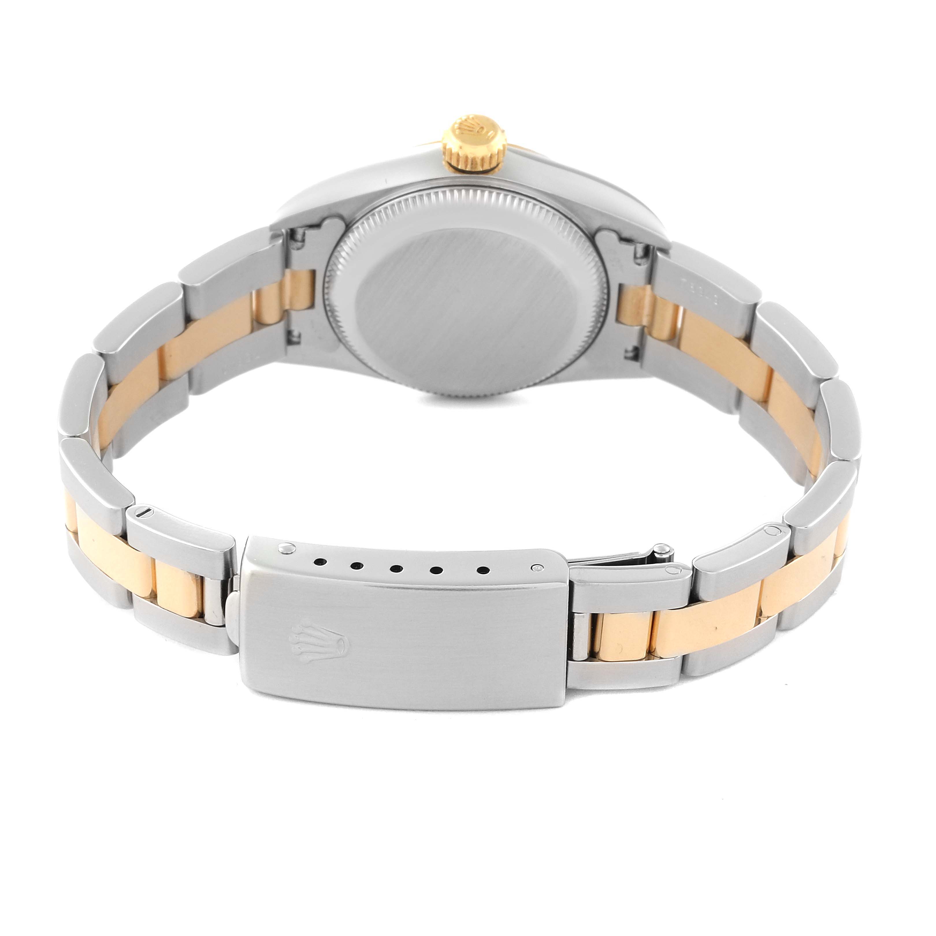 The image shows the back view of a Rolex Oyster Perpetual 67193 Women's Steel and Gold (two tone) Champagne Dial 67193 Women's Steel and Gold (two tone) Champagne Dial watch, highlighting its bracelet, clasp, and crown.