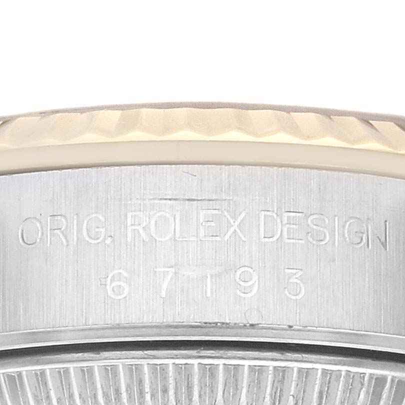 The image shows a close-up of the bezel and case side of a Rolex Oyster Perpetual 67193 Women's Steel and Gold (two tone) Champagne Dial 67193 Women's Steel and Gold (two tone) Champagne Dial, displaying the model number and the inscription “ORIG. ROLEX DESIGN.”