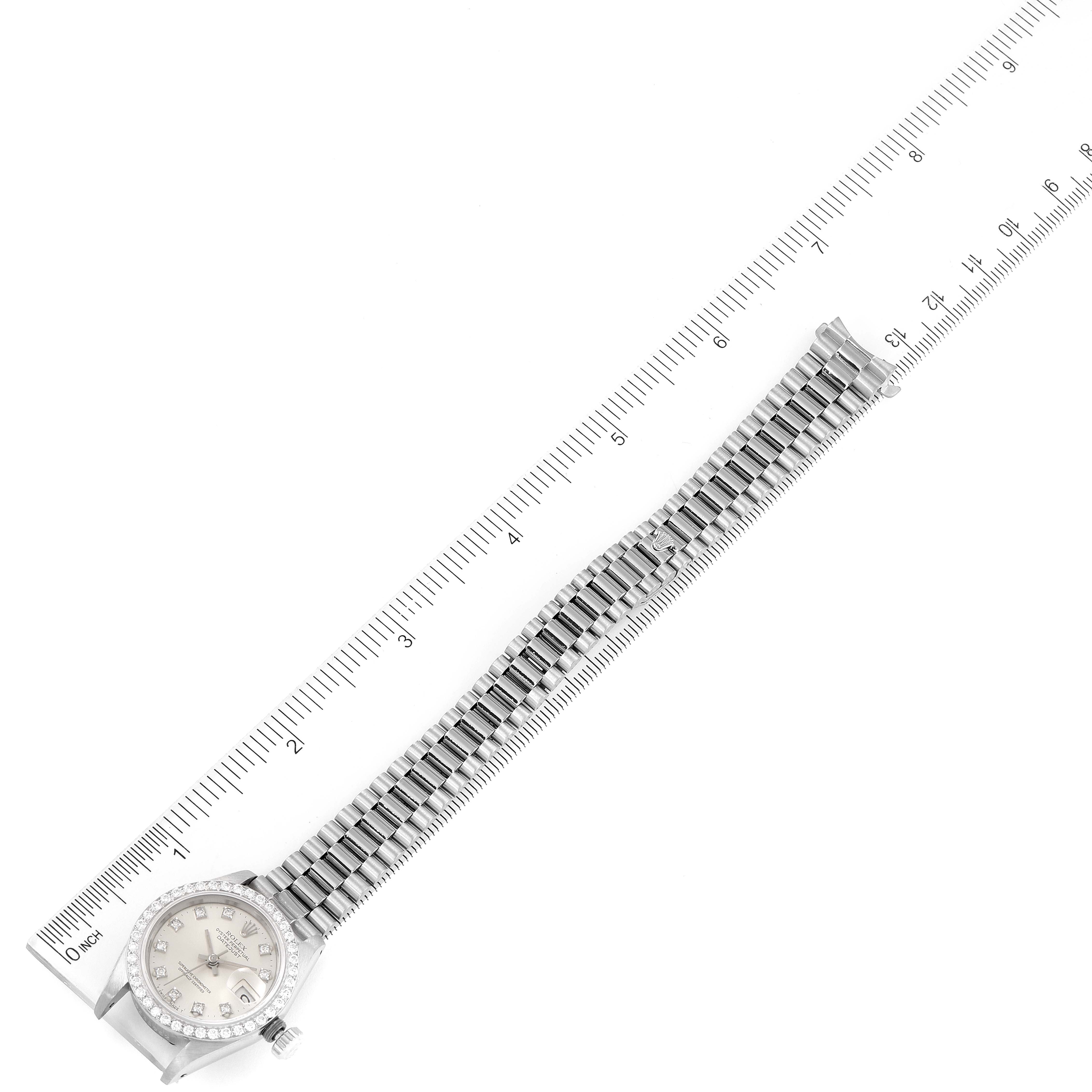 The image shows a top-down view of a Rolex President 69139 Women's White Gold Silver Dial 69139 Women's White Gold Silver Dial model watch, including both the face and the full bracelet, with a ruler for scale.