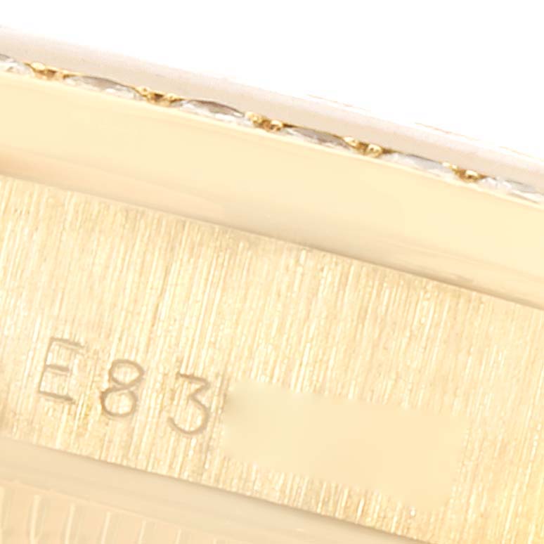 This image shows a close-up of a portion of the band from a Rolex President 68288 Women
s Yellow Gold Champagne Dial 68288 Women
s Yellow Gold Champagne Dial model watch, highlighting some engraved numbers.