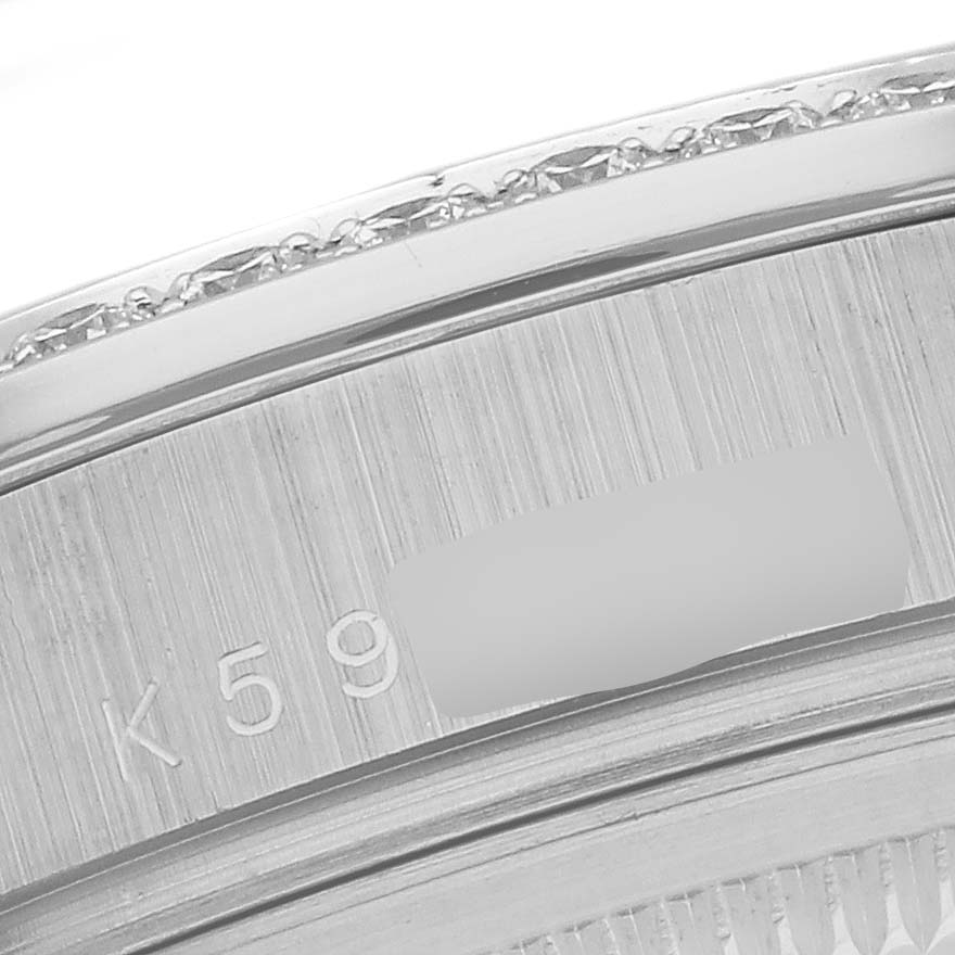 The image shows a close-up of the engraved side of the bezel on a Rolex President 118346 Men's Platinum Silver Dial 118346 Men's Platinum Silver Dial model watch.