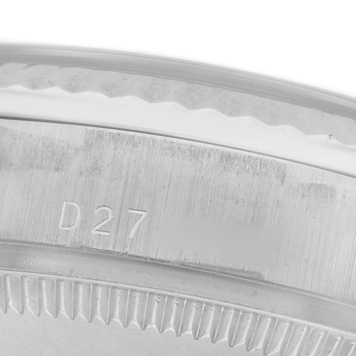 The image shows a close-up of the Rolex Mid-Size 178279 Women
s White Gold Silver Dial 178279 Women
s White Gold Silver Dial watch
s case with engraving detail.