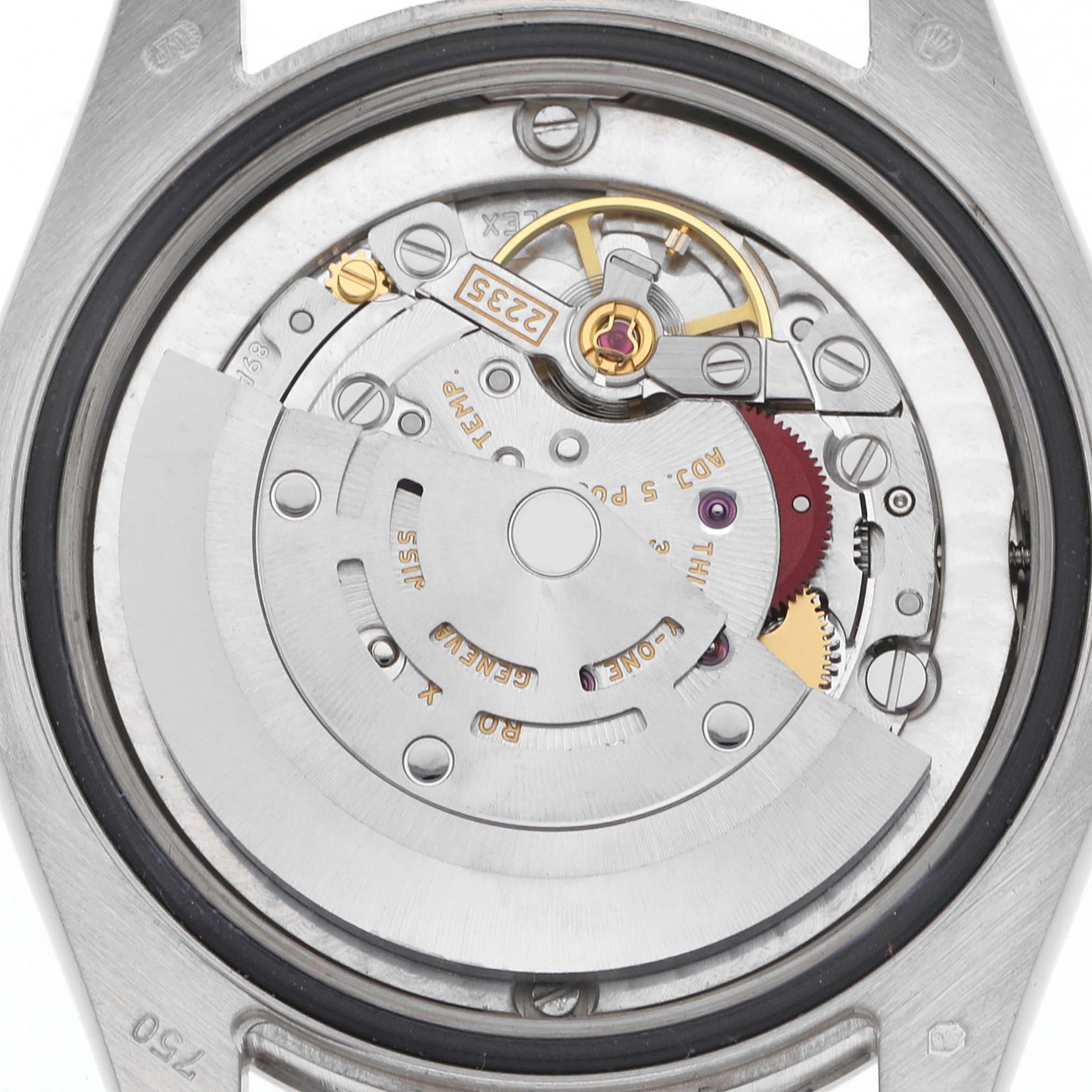 The image shows the movement of a mid-size Rolex watch from a top-down angle, highlighting the rotor and gear assembly.