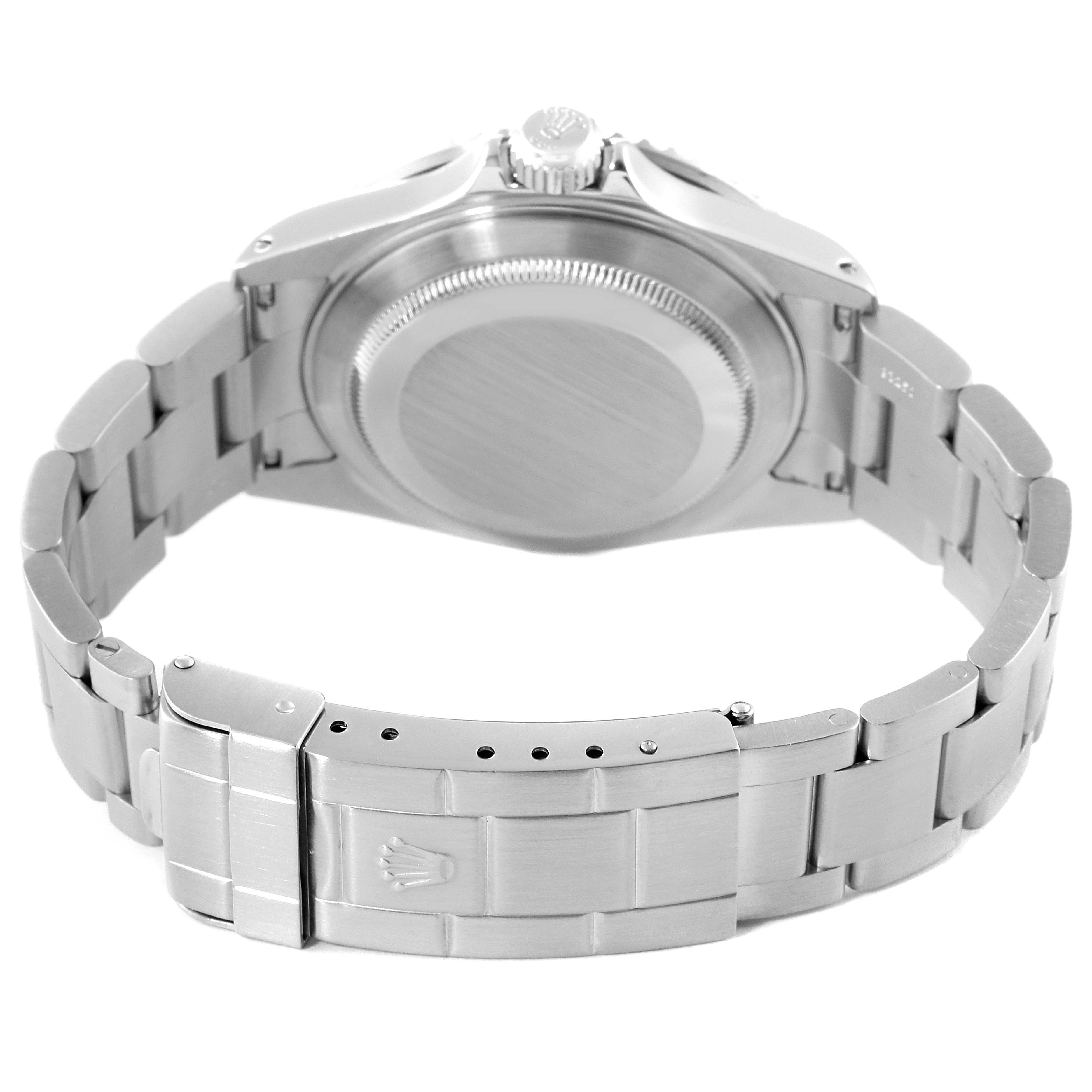 The image shows the backside of a Rolex Submariner 16610 Men's Stainless Steel Black Dial 16610 Men's Stainless Steel Black Dial, highlighting the case back and bracelet clasp.