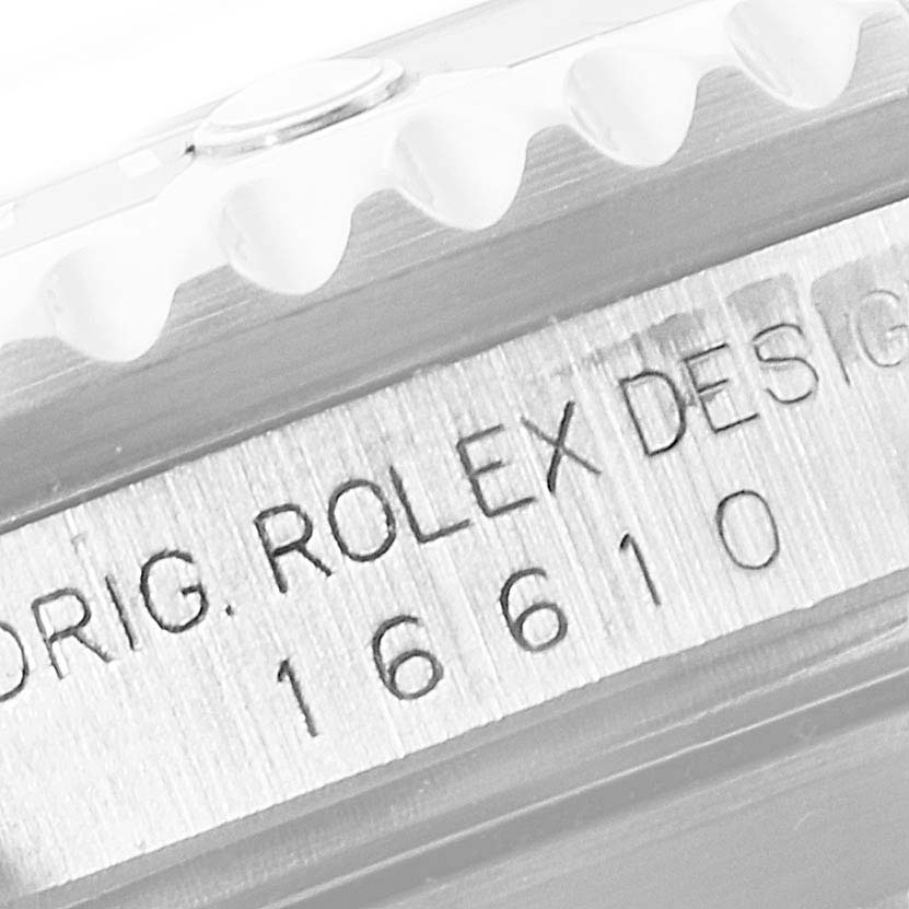 The image shows a close-up of the side of a Rolex Submariner 16610 Men's Stainless Steel Black Dial 16610 Men's Stainless Steel Black Dial, highlighting the model number and part of the bezel.