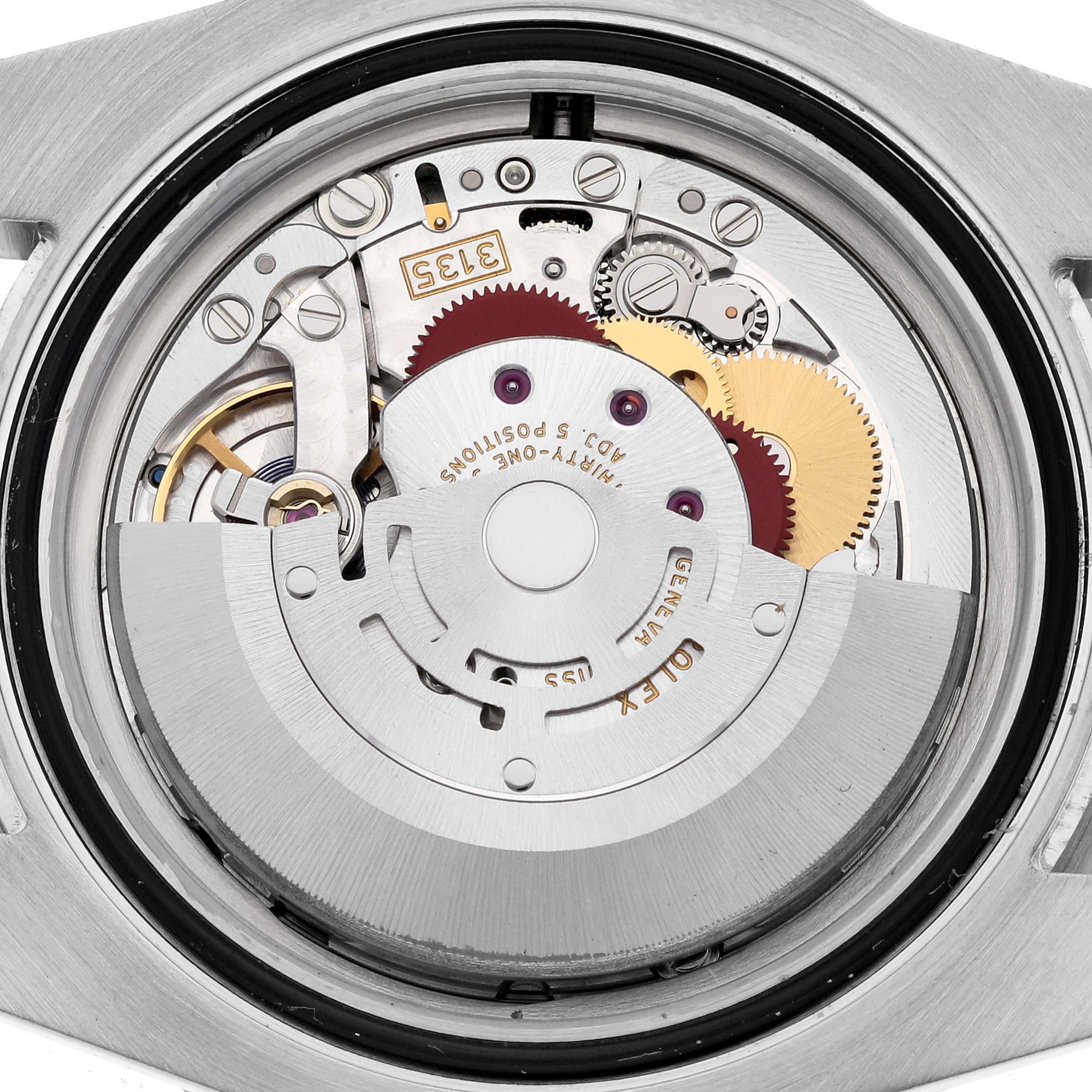 The image shows the internal mechanical movement of a Rolex Submariner 116610 Men
s Stainless Steel Black Dial 116610 Men
s Stainless Steel Black Dial watch from a back angle.