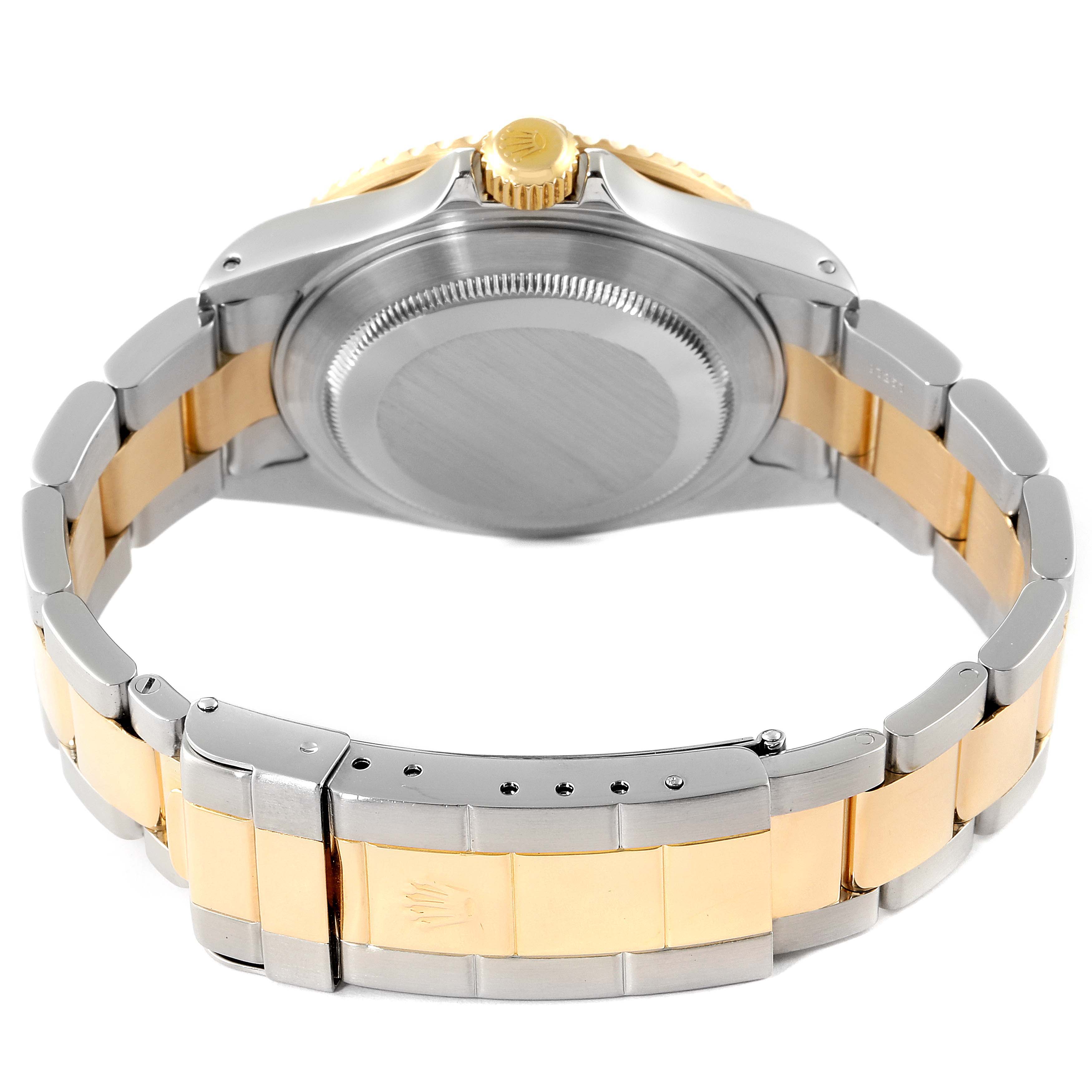 The image shows the back view of a Rolex Submariner 16613 Men
s Steel and Gold (two tone) Black Dial 16613 Men
s Steel and Gold (two tone) Black Dial, highlighting the clasp and case back.