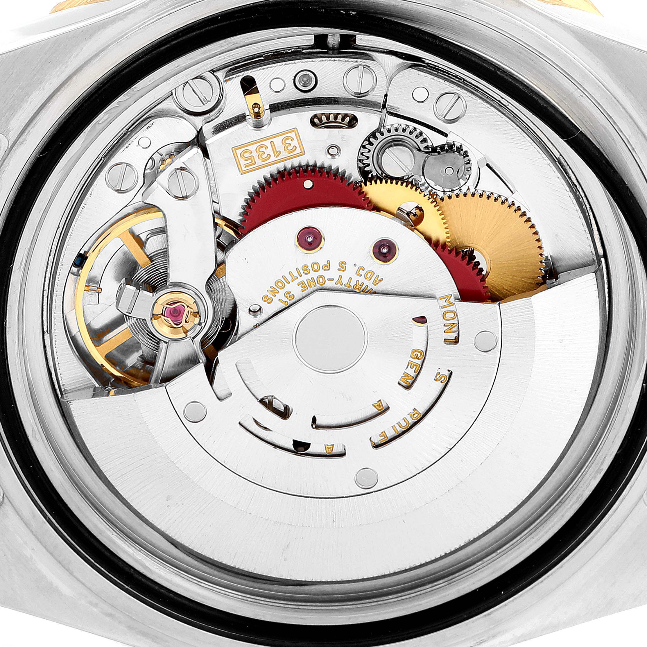 This image shows the movement and inner mechanism of a Rolex Submariner 16613 Men
s Steel and Gold (two tone) Black Dial 16613 Men
s Steel and Gold (two tone) Black Dial watch from a back view.