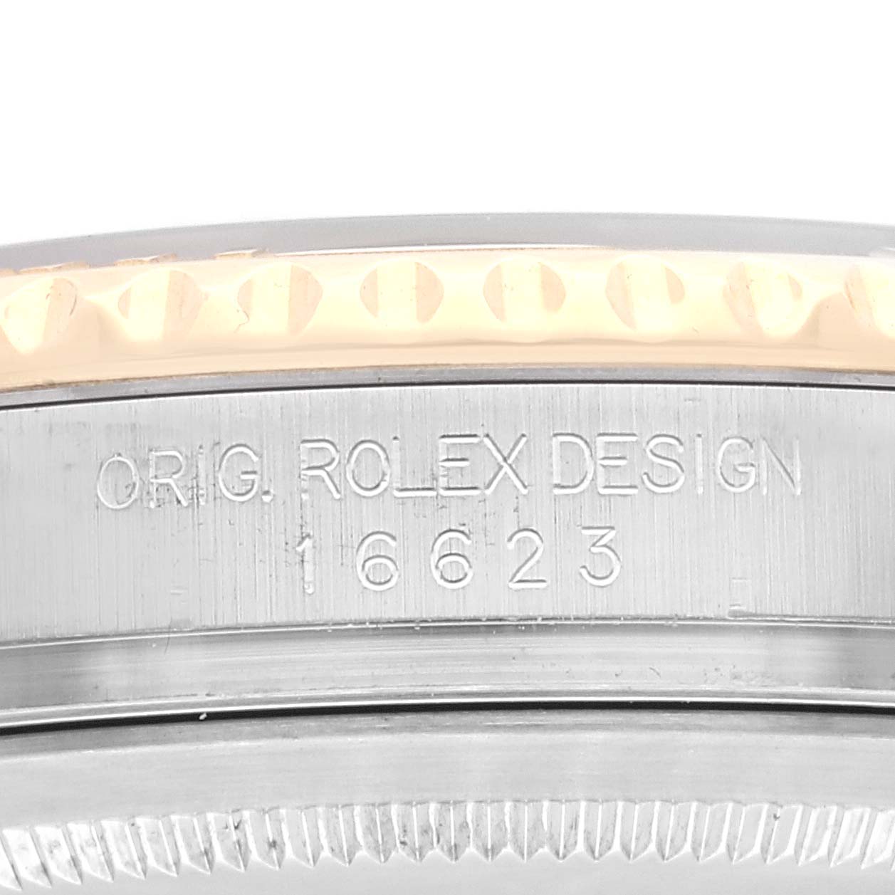 The image shows a close-up view of the engraved side of the Rolex Yacht-Master 16623 Men
s Steel and Gold (two tone) White Dial 16623 Men
s Steel and Gold (two tone) White Dial model, featuring its bezel and case.