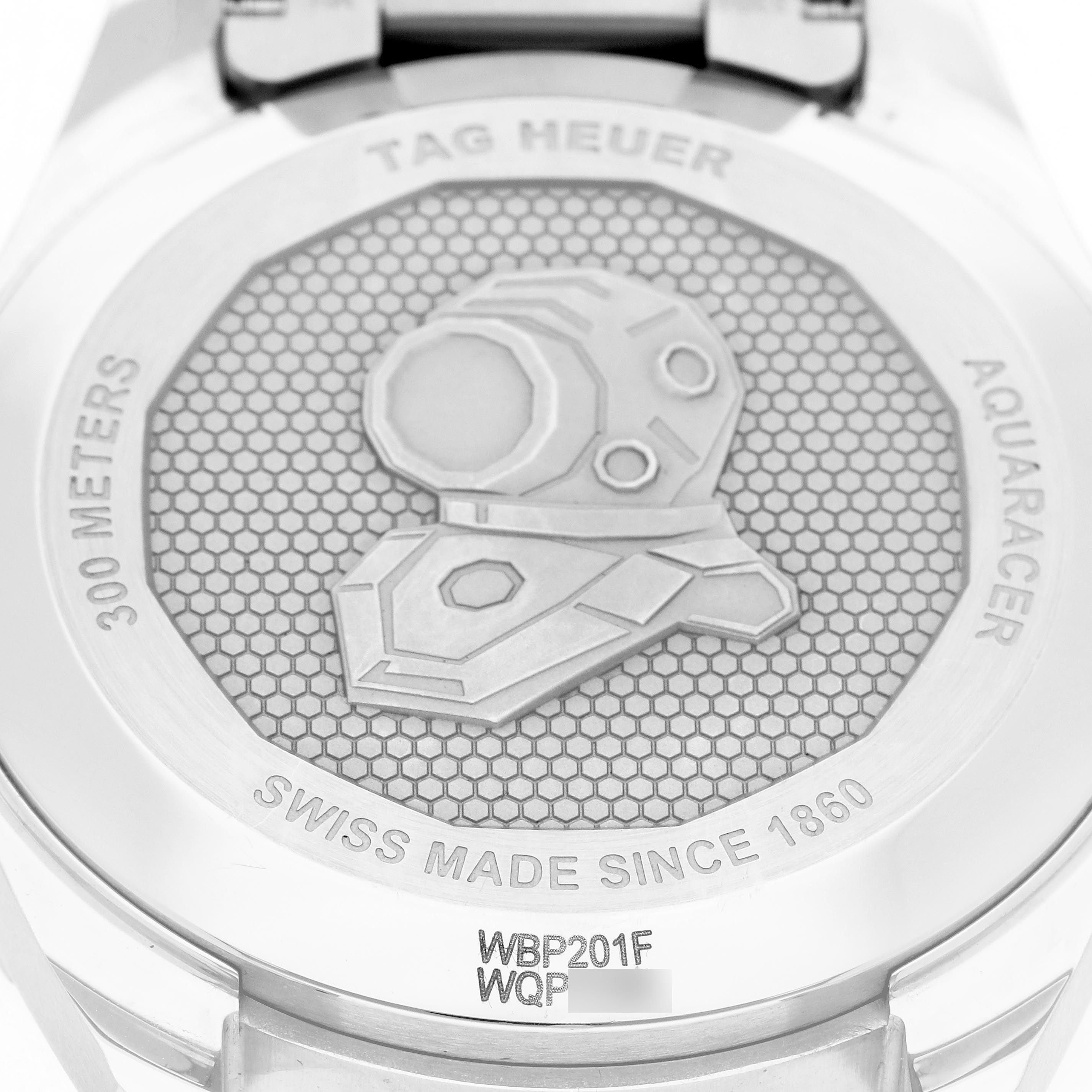 The image shows the back case of a Tag Heuer Aquaracer WBP201F Men
s Stainless Steel Orange Dial WBP201F Men
s Stainless Steel Orange Dial watch, featuring engraved text and a diving helmet design.