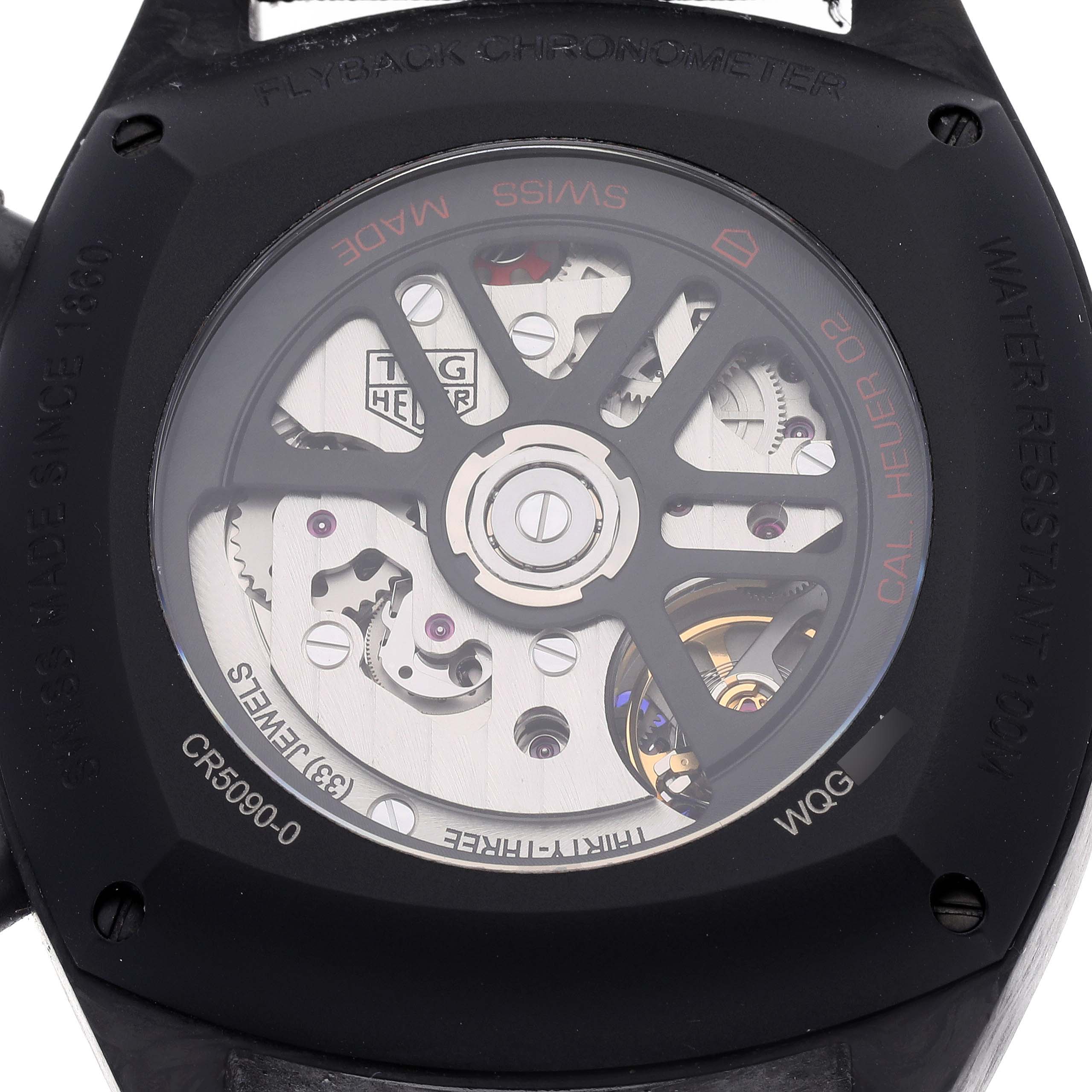 The image shows the back view of the Tag Heuer Monza CR5090.FN6001 Men's Titanium Black Dial CR5090.FN6001 Men's Titanium Black Dial watch, highlighting its internal mechanisms and movement.