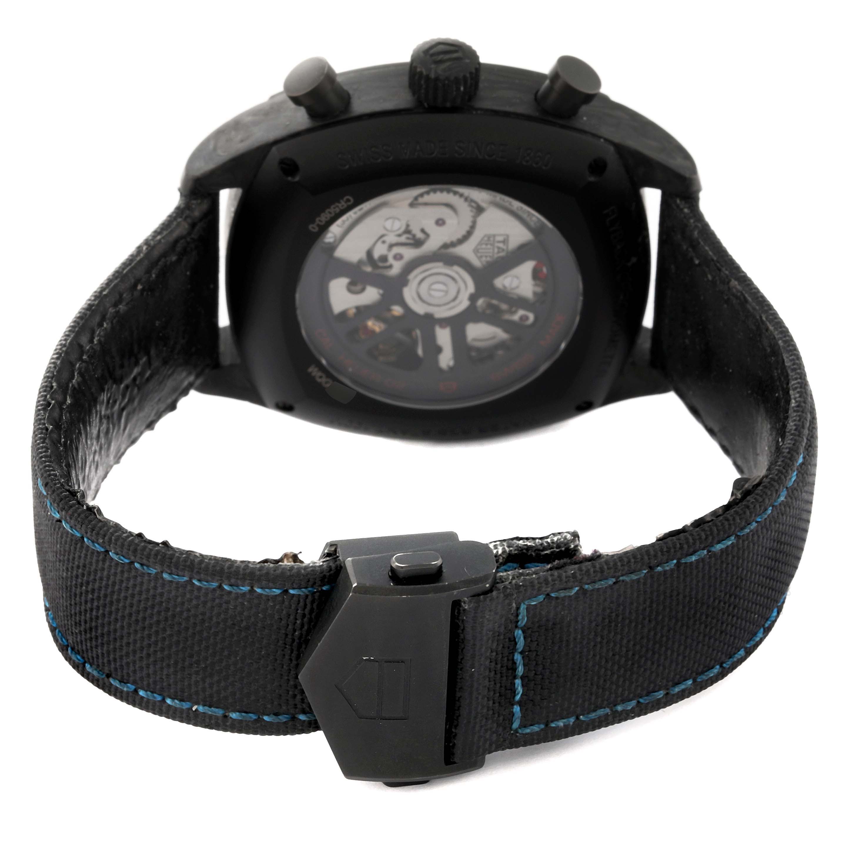 The image shows the back view of the Tag Heuer Monza CR5090.FN6001 Men's Titanium Black Dial CR5090.FN6001 Men's Titanium Black Dial watch, highlighting the open case back and part of the strap.