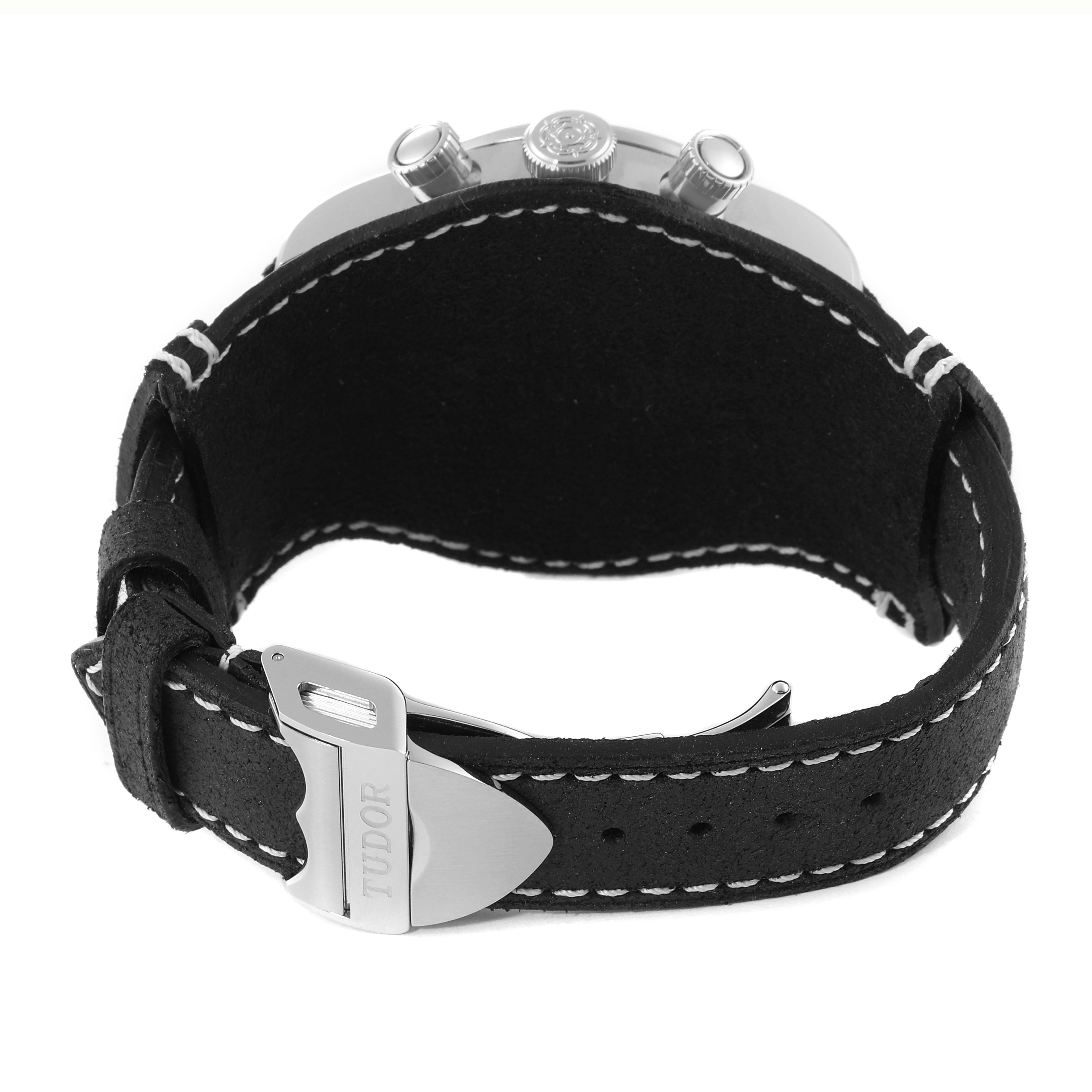 The image shows the back view of a Tudor Heritage Black Bay 79360N Men
s Stainless Steel White Dial 79360N Men
s Stainless Steel White Dial watch, highlighting its black strap and silver buckle.