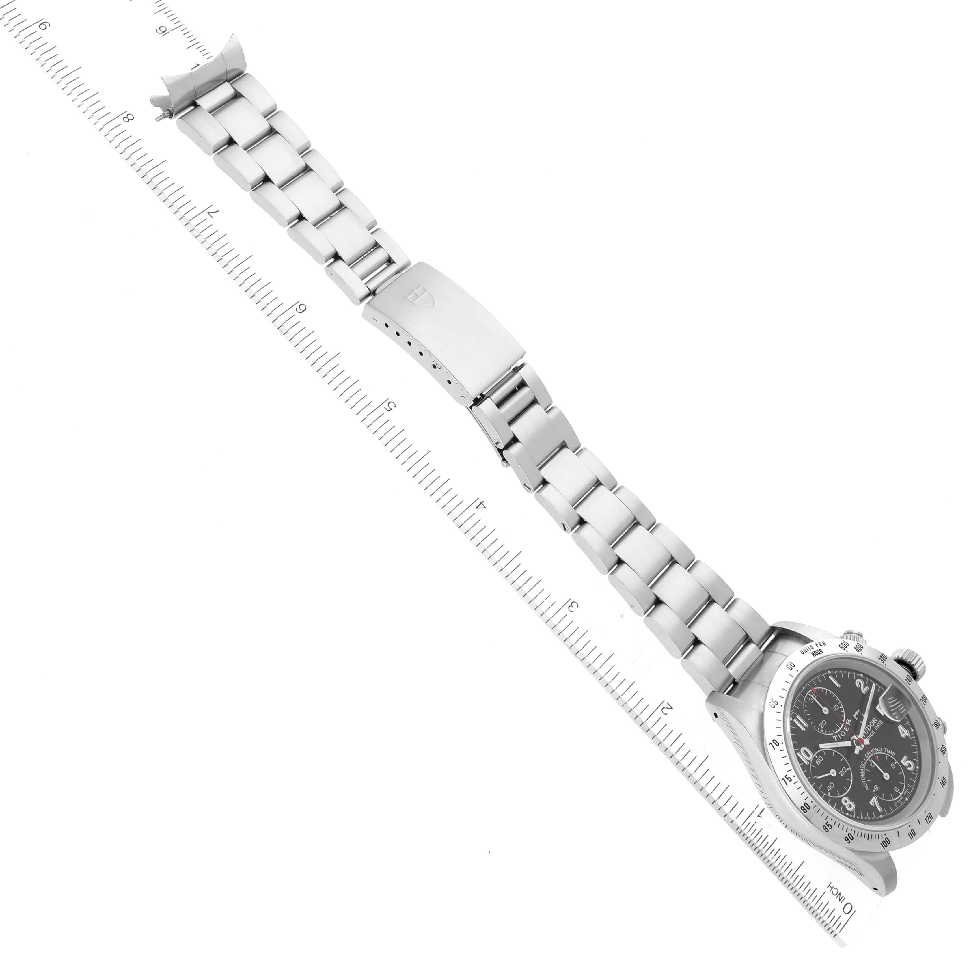 The image shows a Tudor Prince watch from a top angle, displaying the face, bracelet, and clasp laid alongside a ruler for scale.