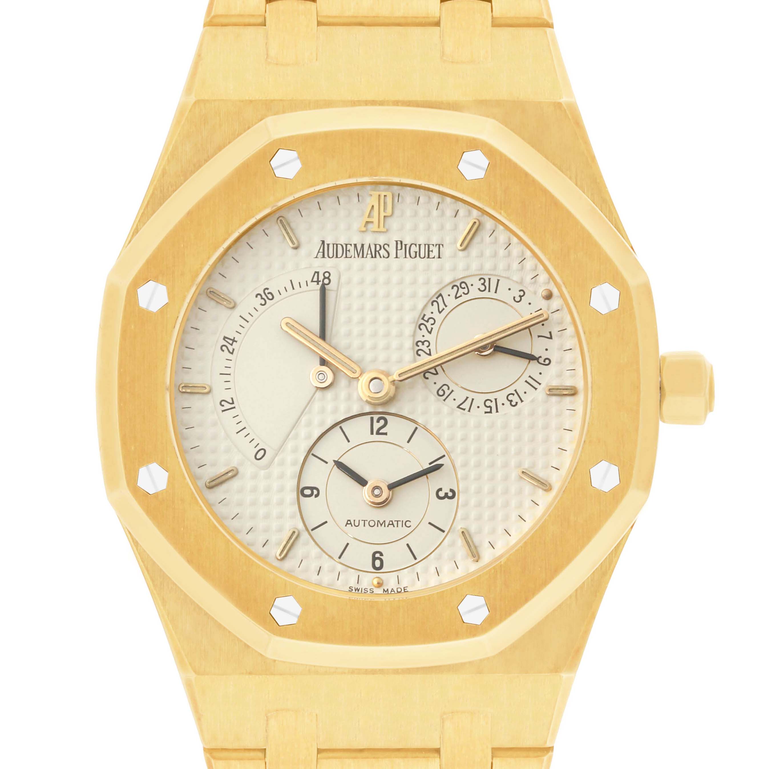 The image shows a front view of an Audemars Piguet Royal Oak 25730BA Men's Yellow Gold Silver Dial 25730BA Men's Yellow Gold Silver Dial watch, detailing the dial, hands, and subdials.