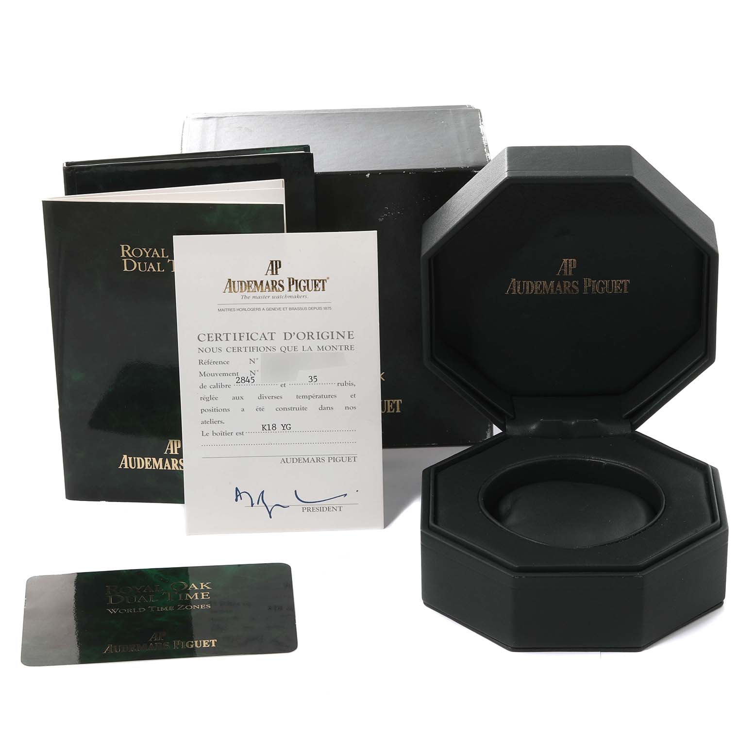 The image shows the packaging, certificate, and booklets for an Audemars Piguet Royal Oak 25730BA Men's Yellow Gold Silver Dial 25730BA Men's Yellow Gold Silver Dial watch from a front angle.