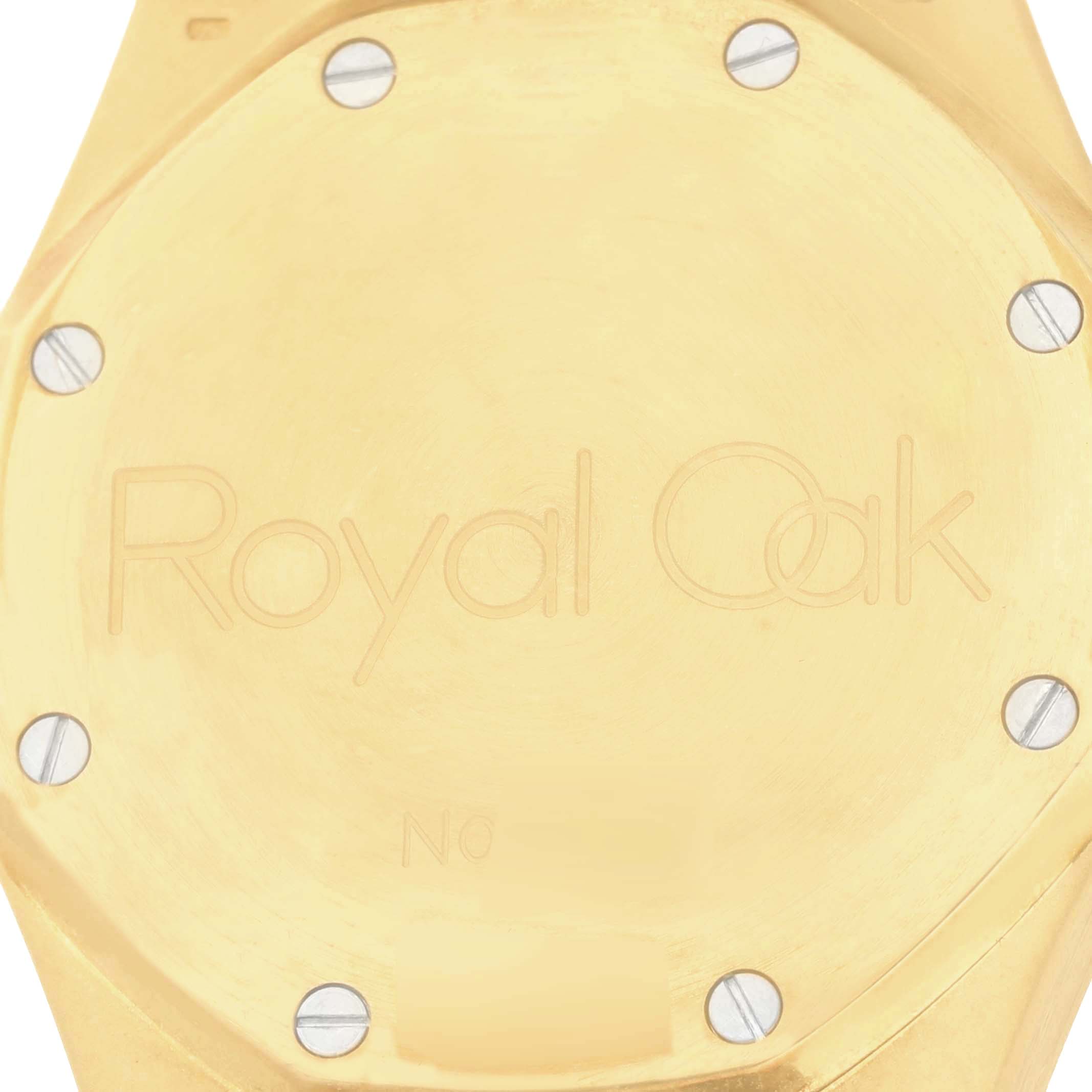 This is the backside of an Audemars Piguet Royal Oak 25730BA Men's Yellow Gold Silver Dial 25730BA Men's Yellow Gold Silver Dial watch, showing the engraved logo and screws.