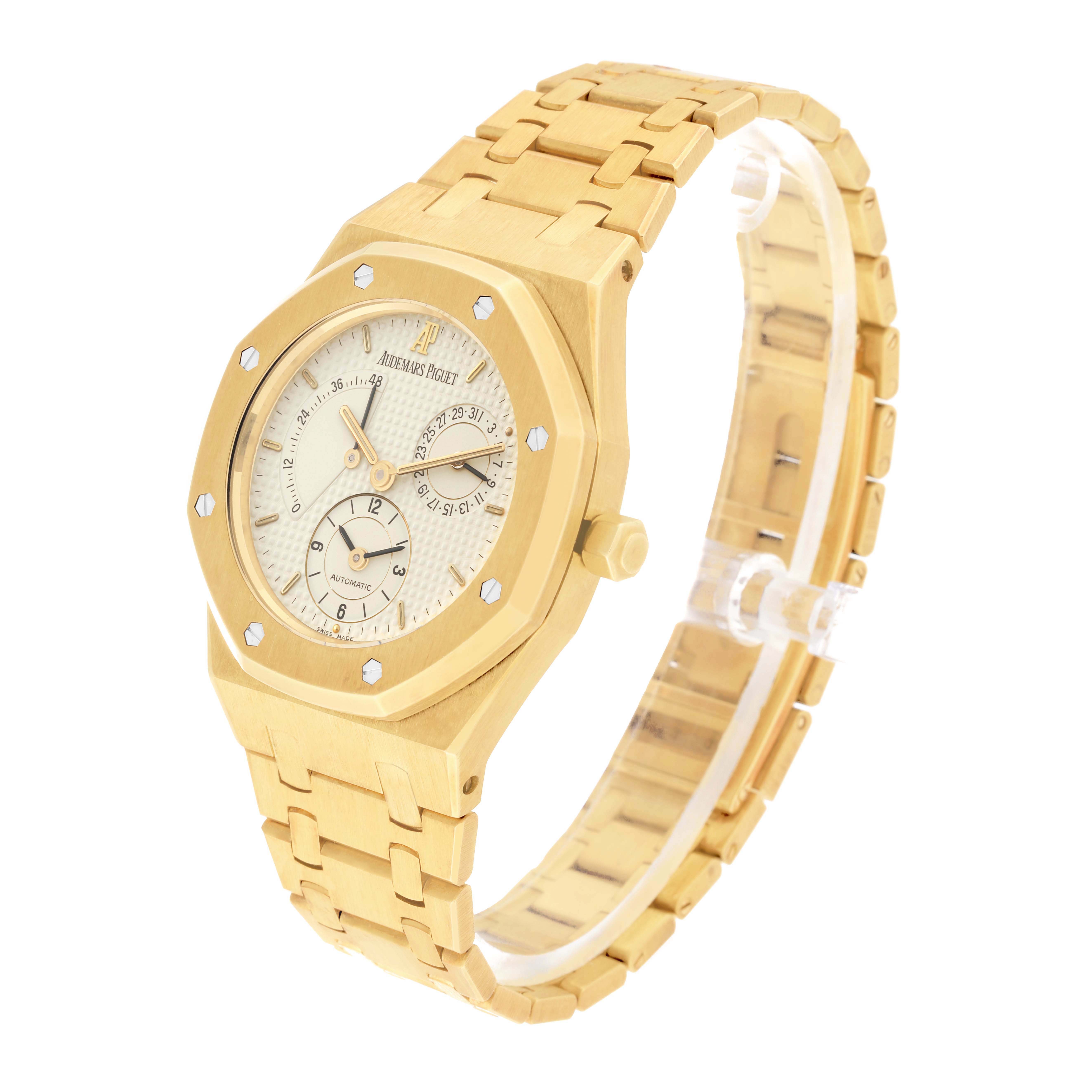 The image shows a diagonally angled view of an Audemars Piguet Royal Oak 25730BA Men's Yellow Gold Silver Dial 25730BA Men's Yellow Gold Silver Dial watch with its face and bracelet visible.