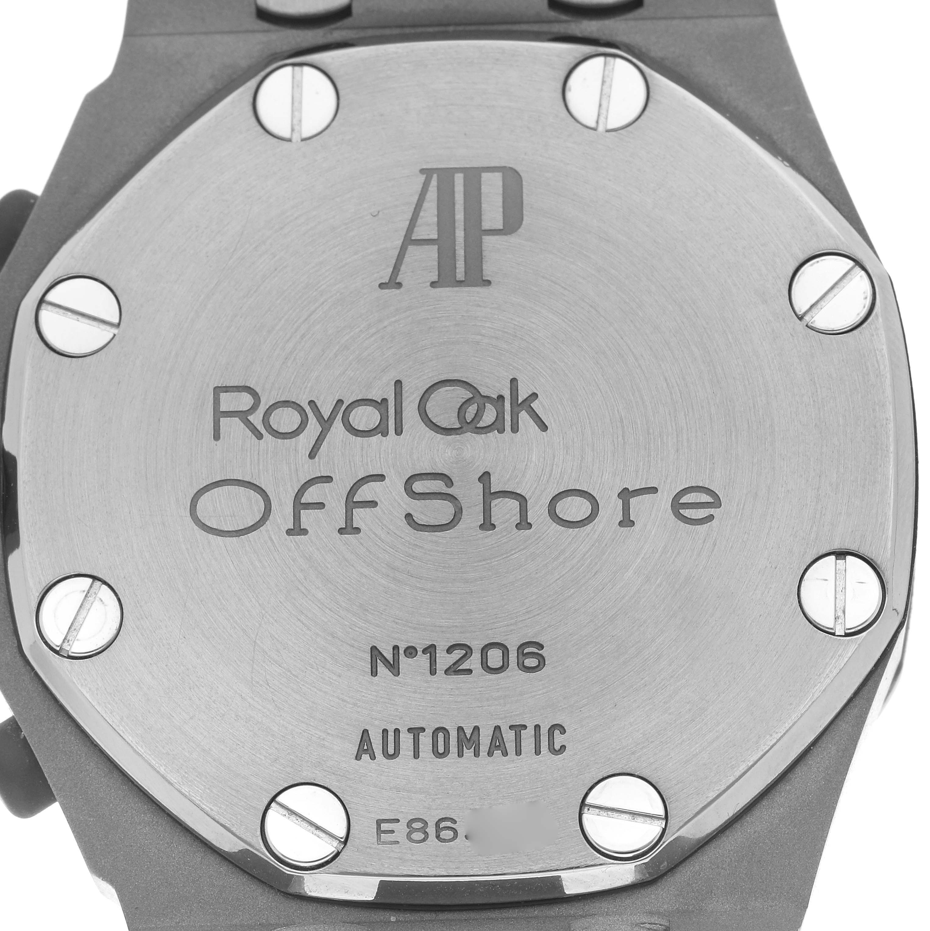 The image shows the back case of the Audemars Piguet Royal Oak Offshore 25721TI.OO.10000TI.301 Men
s Titanium Grey Dial 25721TI.OO.10000TI.301 Men
s Titanium Grey Dial, displaying screws and engraved details.