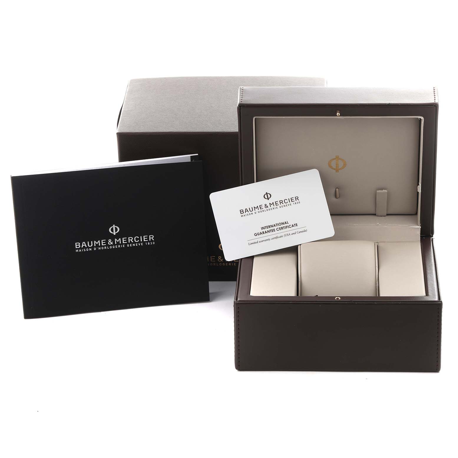 The image shows a Baume 
Mercier Clifton MOA10342 Men
s Stainless Steel Silver Dial MOA10342 Men
s Stainless Steel Silver Dial watch box, international guarantee certificate, and a booklet, viewed from the front.