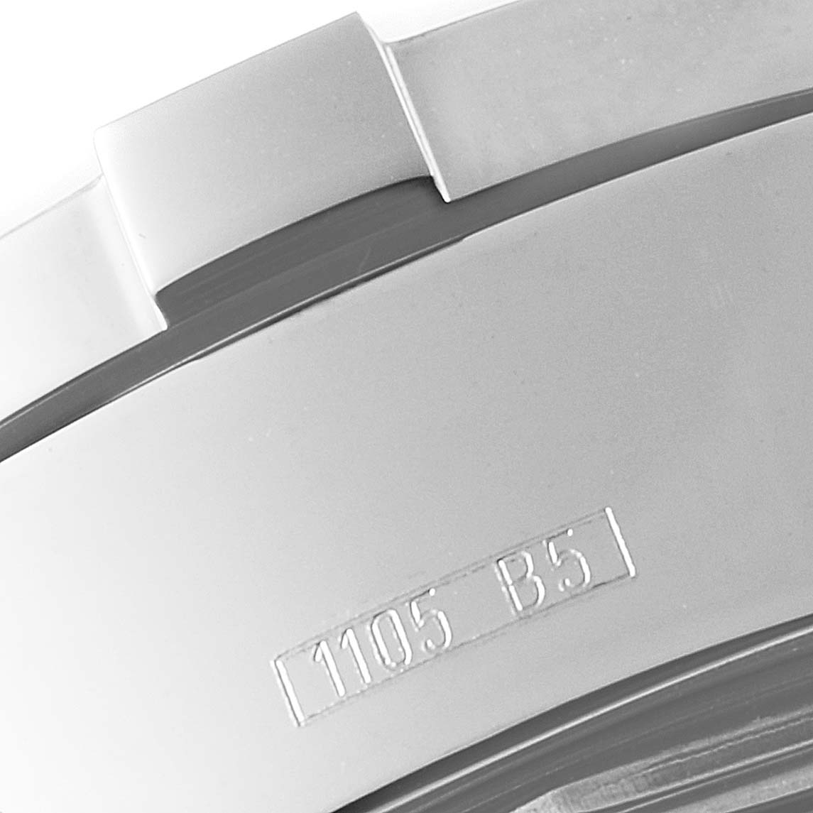 Close-up view of the clasp and part of the bracelet of a Superocean model by Breitling, showing the engraved numbers.