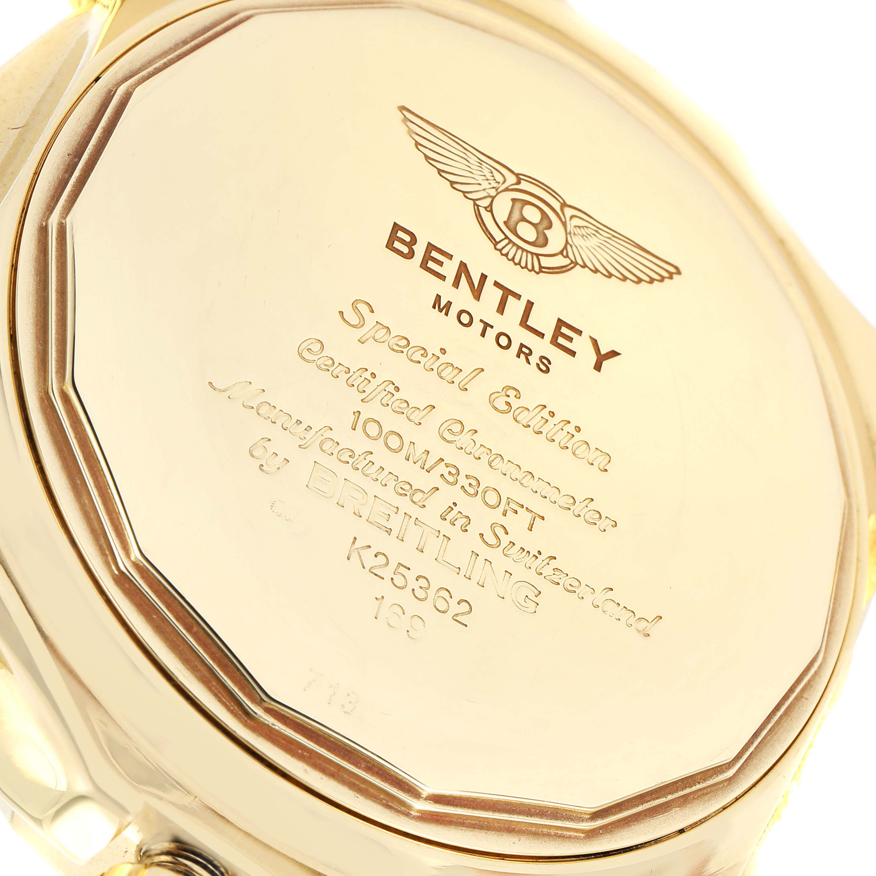 The image shows the back case of a Breitling Bentley K25362 Men's Yellow Gold Black Dial K25362 Men's Yellow Gold Black Dial model watch from a close-up angle.