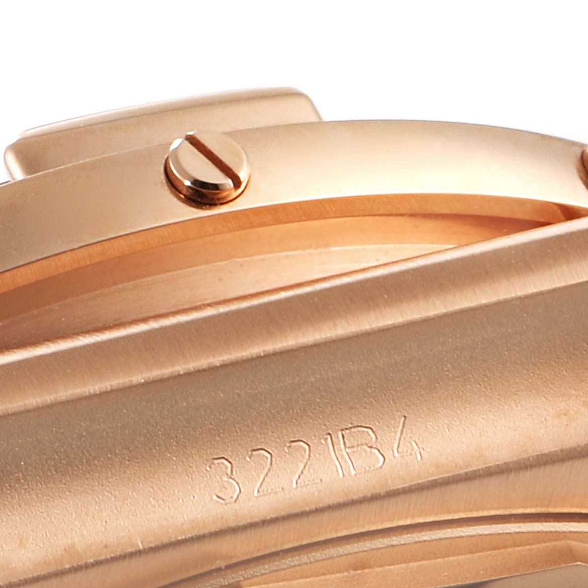 This close-up angle shows the casing and part of the bezel and screws of the Breitling Chronomat RB0136E31Q1R1 Men's Rose Gold Brown Dial RB0136E31Q1R1 Men's Rose Gold Brown Dial watch.