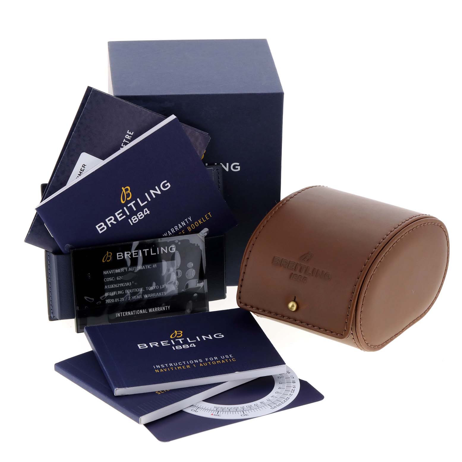 The image shows the packaging, instruction booklet, warranty booklet, and leather travel case for a Breitling Navitimer A17326 Men
s Stainless Steel Silver Dial A17326 Men
s Stainless Steel Silver Dial watch.